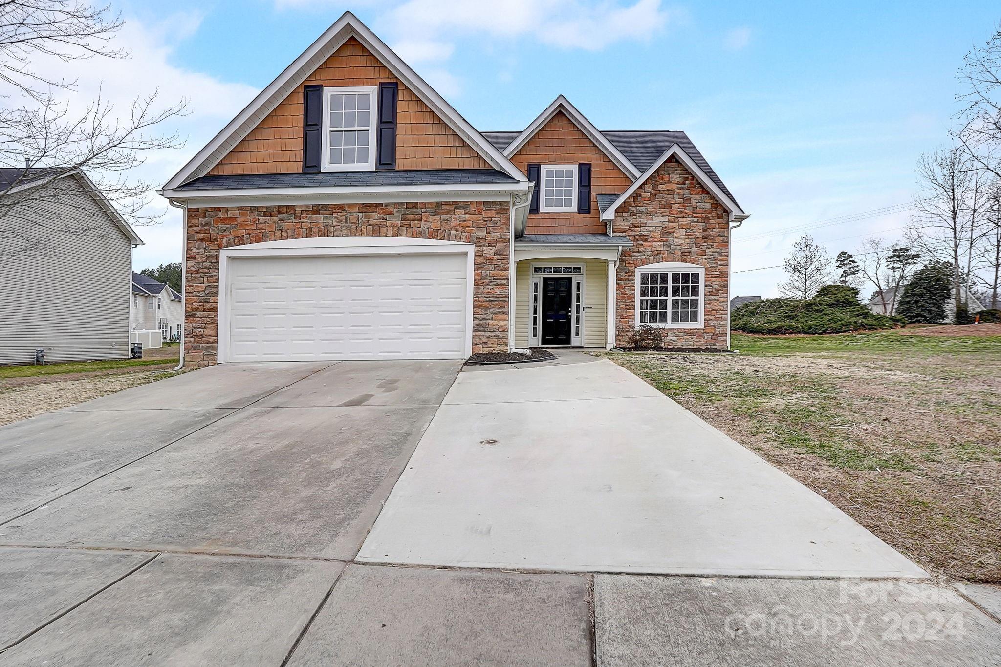 Welcome home to this beautiful 5 bed, 2.5 bath home in Monroe! You will love the neighborhood and the living space this home offers! Main level primary suite, office/formal dining room and updated kitchen features granite countertops and stainless steel appliances. Primary suite offers double sink vanity, walk in shower and soaking tub. Fresh interior paint, new light fixtures and all new flooring throughout w/ Luxury Vinyl Plank in main living areas and new carpeting in bedrooms. 4 large bedrooms on second level and 2 car garage as well! Schedule your showing today!