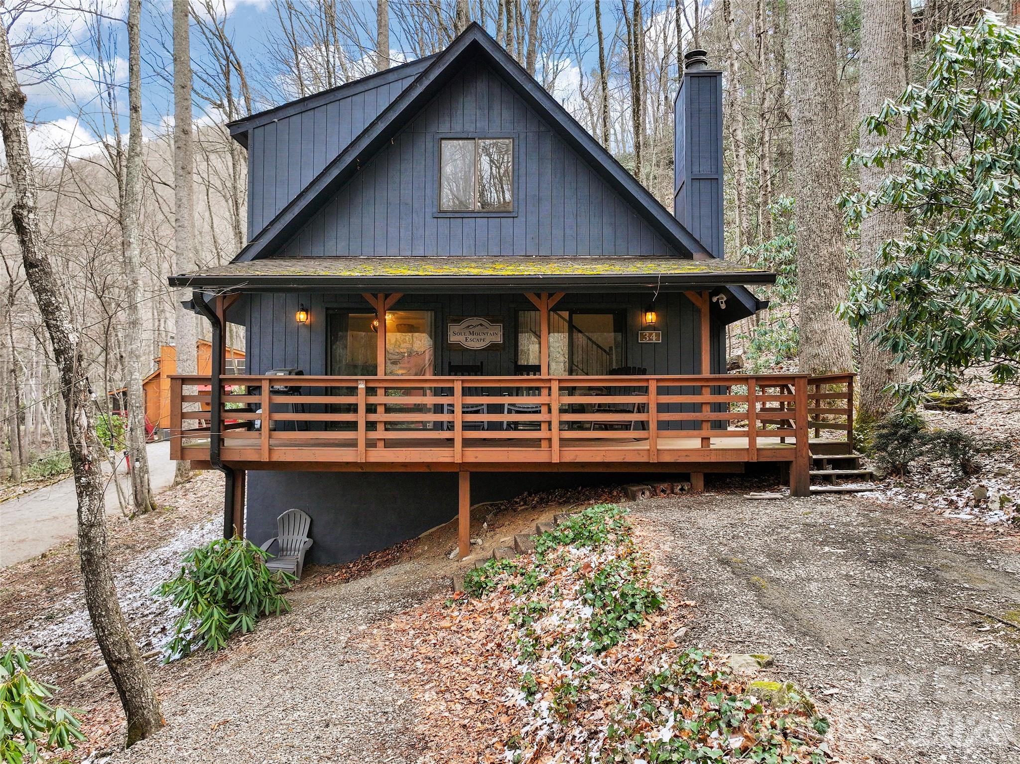 Nestled on the mountain and in the woods, this adorable cabin is a charming "gem" offering the perfect blend of a serene private retreat and a proven income-producing vacation rental. The inviting open-concept interior is anchored by a wood-burning stone fireplace, creating a warm atmosphere that is both cozy and super attractive. Sold fully furnished, this home is ready for you to move in as a primary residence, use as a second-home getaway, or continue offering as a turnkey short-term rental. Enjoy the best of mountain living by relaxing on the rocking chair front porch or gathering around the outdoor firepit under the stars. The location is unbeatable for recreation and entertainment, situated just minutes from the Blue Ridge Parkway, Cataloochee Ski Area for skiing and snowboarding and Harrah’s Cherokee Casino. You are also a short drive from historic downtown Waynesville’s farm-to-table restaurants and craft breweries, as well as local golf and tennis. Whether you are looking for a peaceful sanctuary or a smart investment, this appealing property delivers the quintessential Western North Carolina lifestyle.