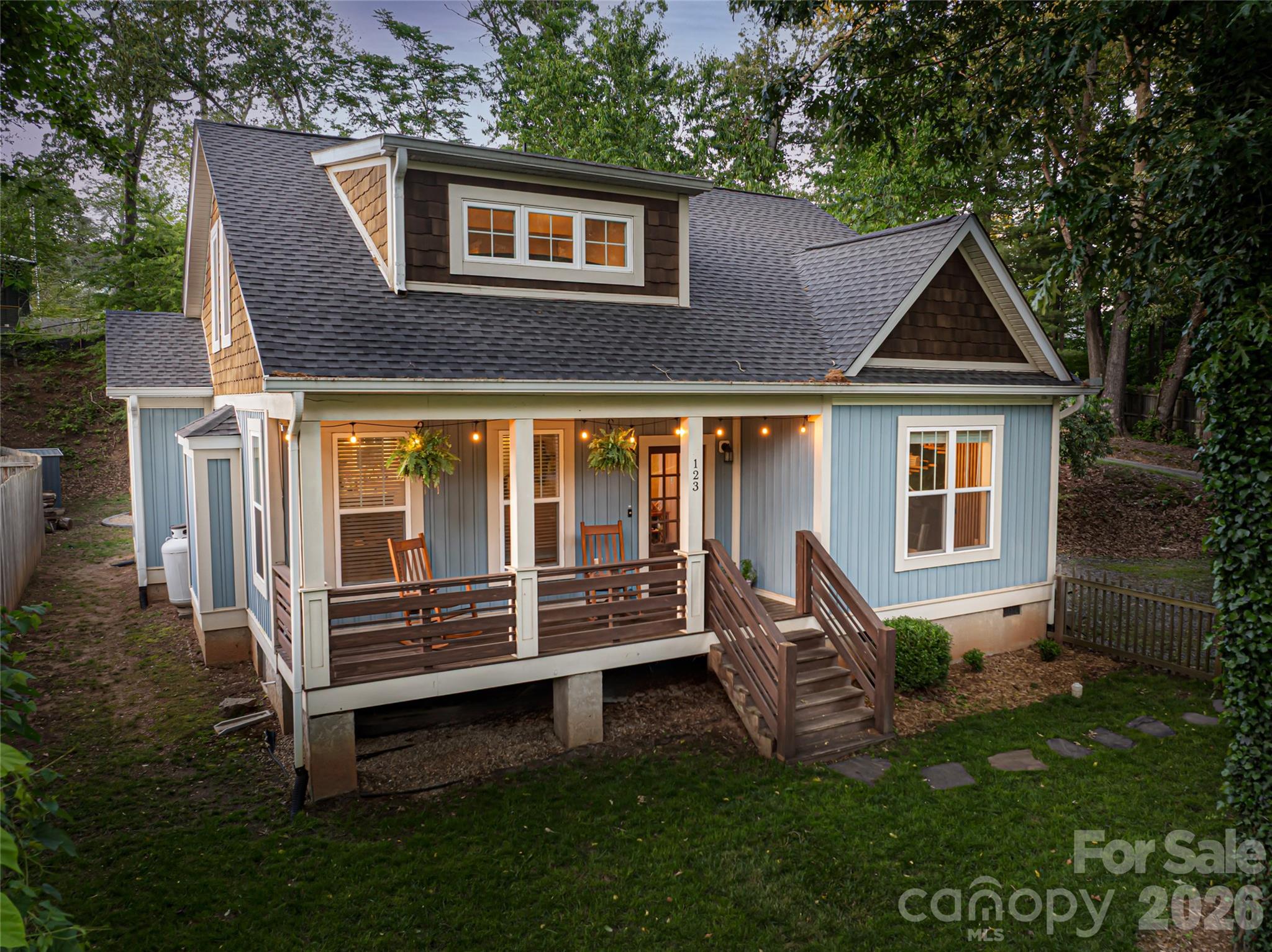 Ideally tucked away on a quiet dead-end street, this exceptional home offers rare privacy just moments from the energy of Haywood Road and Asheville’s best dining, culture and entertainment. A welcoming front porch, new back deck, fully fenced backyard, and new roof create an ideal setting for relaxing or entertaining in peaceful seclusion. Inside, the living room features a classic fireplace and abundant natural light. The main-level primary suite provides comfort and privacy with a walk-in closet and convenient access to laundry and kitchen. Designed for everyday living and special gatherings, the kitchen serves as heart of the home. With four bedrooms and three full baths, the flexible layout easily accommodates guests, family or home offices. Just off Pineview Street, this home offers a rare blend of serenity and city convenience, with downtown Asheville, the River Arts District and Blue Ridge Parkway all within easy reach. Seller is offering credit at closing for floor refinishing.