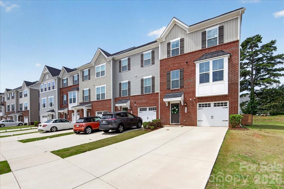 Welcome to this Desirable End-Unit Townhome in Sought-After Grantham Place at Regent Park — Move-in ready with the Opportunity for a Quick Close! Enjoy the Benefits of Low South Carolina Property Taxes, Top-Rated Fort Mill Schools, and an Unbeatable Location just minutes from Historic Downtown Fort Mill, Baxter Village, I-77, and I-485 for an Easy Commute anywhere in the Charlotte Metro Area.The Versatile Main-Level Flex Space offers Endless Possibilities and is Perfect for a Private Multi-Generational Bonus Room, Home Office, Workout Area, or Hobby Room. Upstairs, the Bright and Open-Concept second level is filled with Natural Light and Designed for both everyday Living and Entertaining. The Chefs Kitchen features Granite Counter Tops,SS Appliances & Abundant Cabinetry While flowing Seamlessly into the Breakfast/Dining Area and Spacious Great Room, with Direct Access to the Balcony — Ideal for Relaxing Mornings or Hosting Friendly Gatherings.  The Thoughtfully Designed Third Level serves as a Private Retreat, Featuring a Spacious Primary Suite with a Luxurious en-suite Bath, Convenient Laundry Room Access, and Two Generous Guest Bedrooms that Provide Flexibility for A Great Nights Sleep or Additional Work Space.  Residents of Regent Park Enjoy a Relaxing  Lifestyle with Club-Like Amenities, Including an Outdoor Pool, Tennis Courts, Playgrounds, and a Beautifully Appointed Clubhouse!