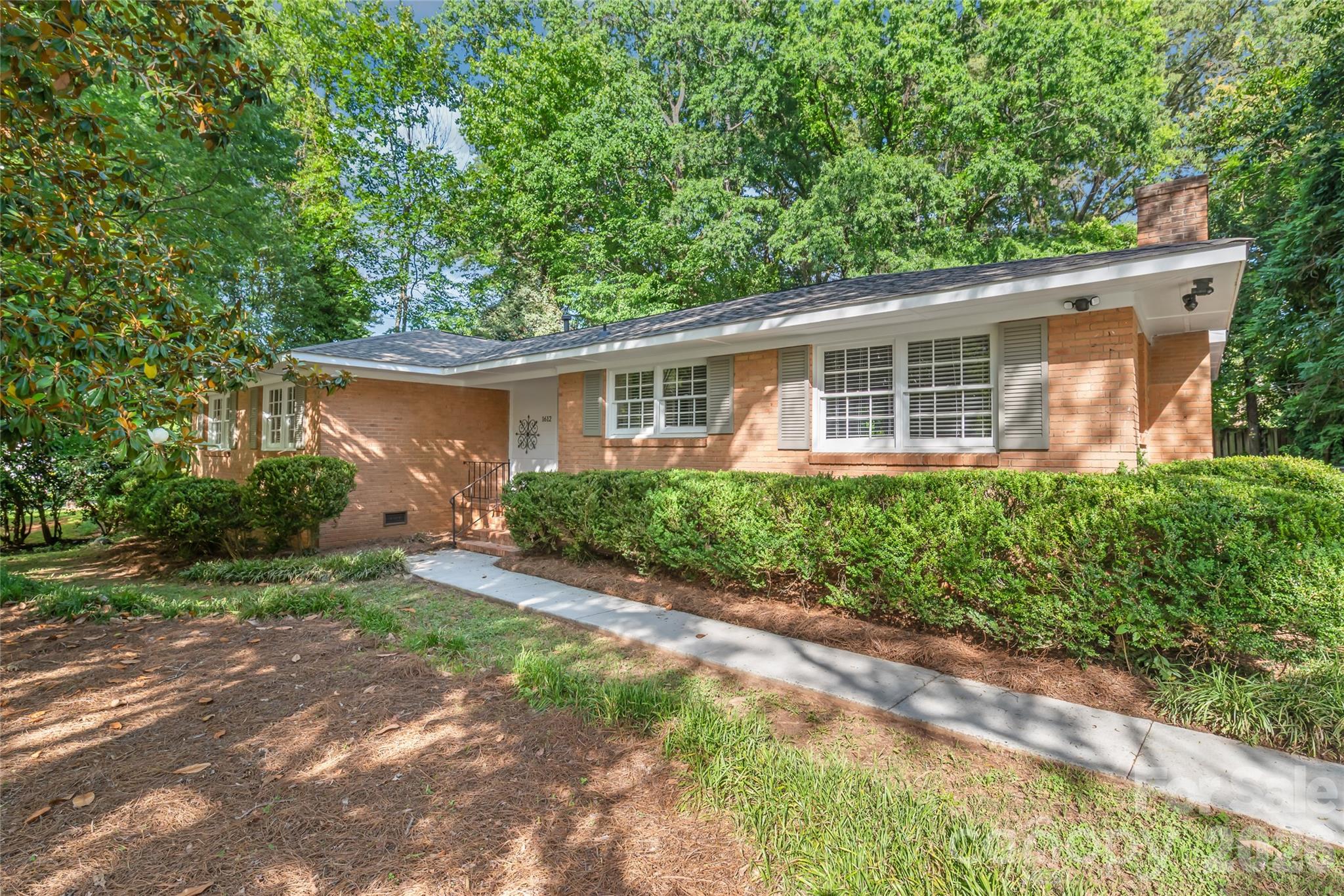 This solidly built brick ranch offers timeless character, exceptional value, and the peace of mind that comes with major system updates already completed. Freshly painted and move-in ready, this home presents the perfect opportunity to enjoy today while adding your personal touch over time.

Located just minutes from SouthPark, Cotswold, and Uptown Charlotte, the property combines a peaceful residential setting with outstanding convenience to shopping, dining, and employment centers.

Recent improvements include a brand-new roof, fireplace and chimney repairs, new plumbing lines, crawl space repairs with a new moisture barrier and insulation, and a professional HVAC tune-up. The costly big-ticket items have already been addressed, allowing the next owner to purchase with confidence.

Inside, you'll find refinished hardwood floors throughout, spacious bedrooms, and a thoughtfully designed floor plan. The large kitchen serves as the heart of the home, featuring a center island, granite countertops, tile backsplash, and beautiful cabinetry, perfect for both everyday living and entertaining. Just off the kitchen, the dining area is anchored by a decorative fireplace with a rustic wood mantel, adding warmth and character.

The oversized living room features a bay window overlooking the deck, filling the space with natural light. Additional flex space provides endless possibilities for a home office, sitting room, playroom, or secondary dining area.

The home offers three generously sized bedrooms, including a primary suite with an ensuite bathroom and dual closets.

Outside, enjoy a fully fenced backyard and oversized deck, creating the perfect setting for entertaining, relaxing evenings, or your own private outdoor retreat.

With major repairs completed, move-in-ready condition, a prime location, and room to add future value, this is a rare opportunity to own a well-maintained home in one of Charlotte's most desirable areas.