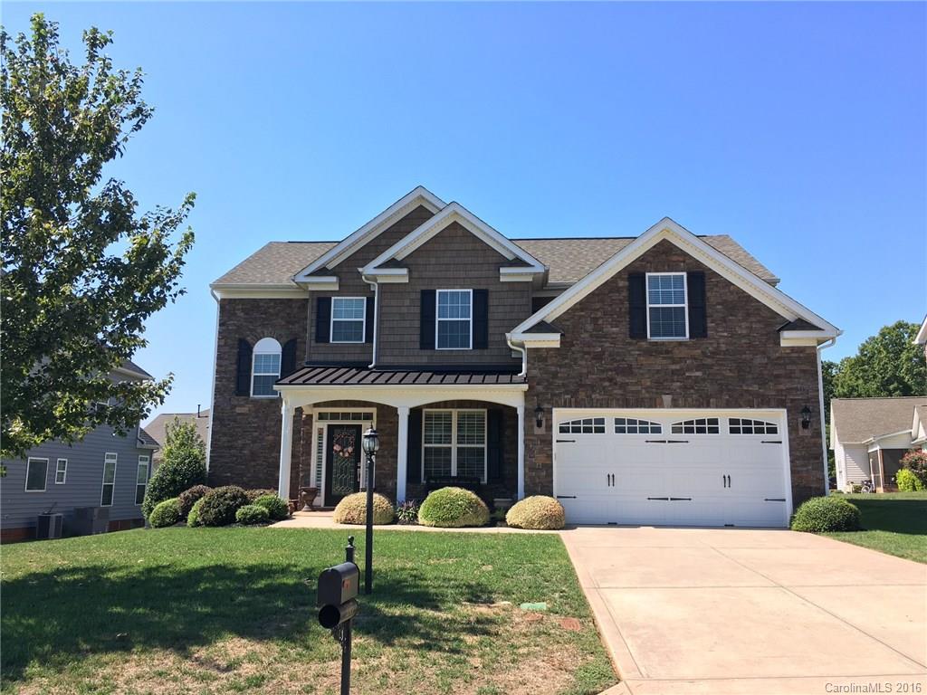 Gorgeous like new home in Mill Creek Falls. Great Clover Schools! This house has tons of upgrades including fabric insulated shades & custom plantation shutters, tile backsplash, granite, double oven, gorgeous cabinetry, under cabinet lights, soft close drawers, recessed lighting & ceiling fans throughout! Huge screen porch with weather shades overlooking tree lined, fully irrigated yard. Large master suite w sitting area. Bonus room plus 4 additional bedrooms including a guest room 1st floor!