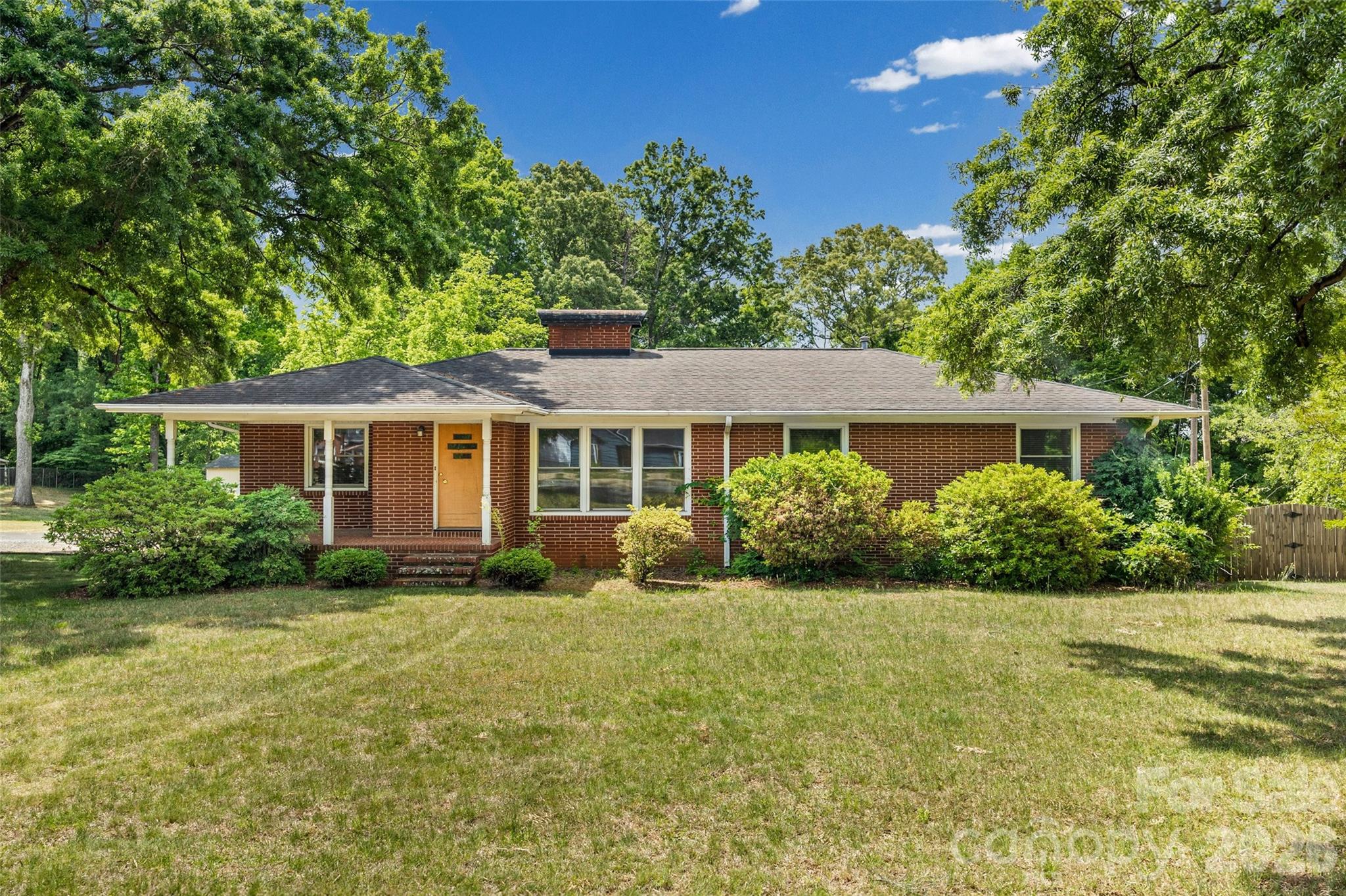 First time ever on the market, this full brick mid-century ranch has been lovingly held in the same family since it was built and is now ready for its next chapter. Filled with character and opportunity, the home features beautiful blonde hardwood floors, spacious living areas, and a partially finished basement offering flexible space and abundant storage.

Situated on a rare .91-acre lot in the city with no HOA, this hidden gem offers the freedom and functionality that are increasingly hard to find. A long shared driveway leads to plenty of parking, making it ideal for buyers needing space for work vehicles, trailers, or equipment. Recent updates include newer windows and HVAC (2021), while the home remains largely in original condition — a great opportunity to renovate, restore, or personalize. The owner recently moved out and, while systems are functioning well to her knowledge, the home is being sold as-is. Conveniently located just minutes from Charlotte Douglas Airport, major highways, shopping, and dining.