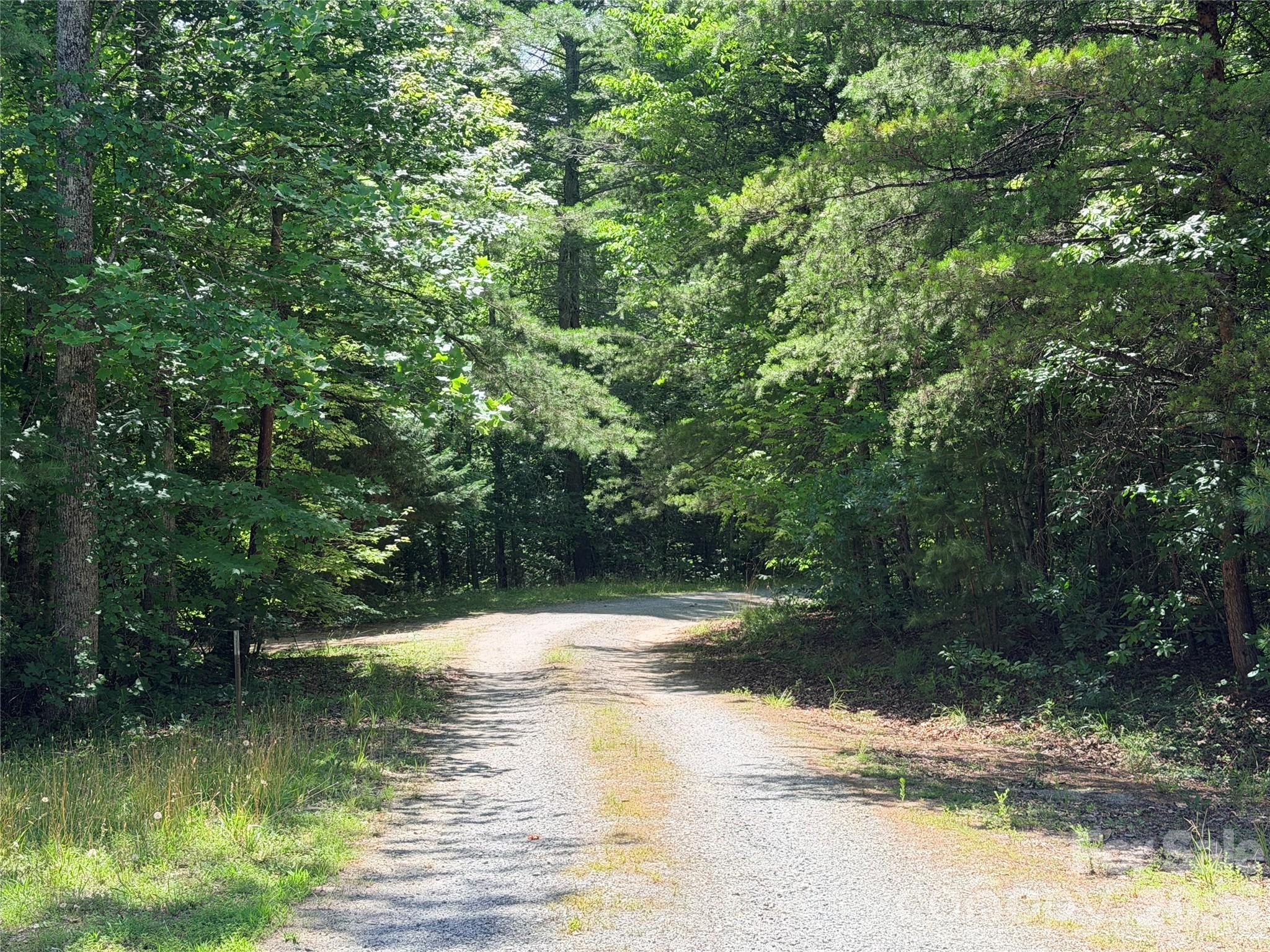 1.86 acres near Ingles Grocery in Lake Lure. This great laying tract will be an easy build and offer plenty of privacy with easy access. There is a 900 sq ft minimum build requirement and the construction must be log.