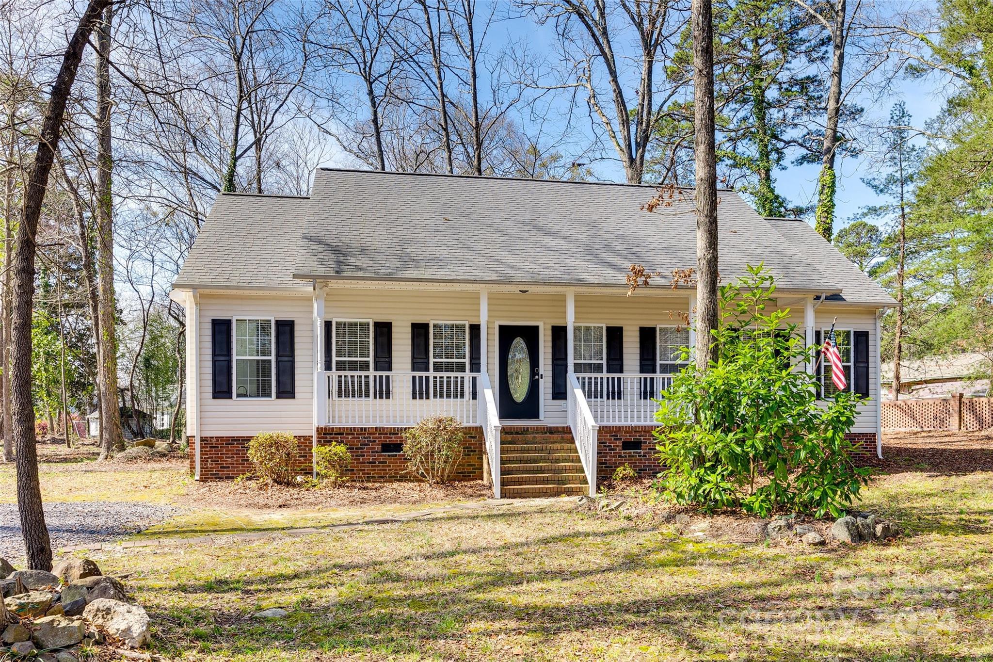 Nestled within the prestigious Rock Hill Country Club neighborhood and conveniently located just minutes away from I-77, this delightful ranch home offers an ideal combination of comfort, convenience, and style. The home features fresh paint, hardwood floors, updated primary en suite, split floorplan and beautiful granite counter tops in the kitchen and primary bath. Enjoy the evenings sitting on the rocking chair front porch or entertaining from the back deck overlooking a huge level back yard.