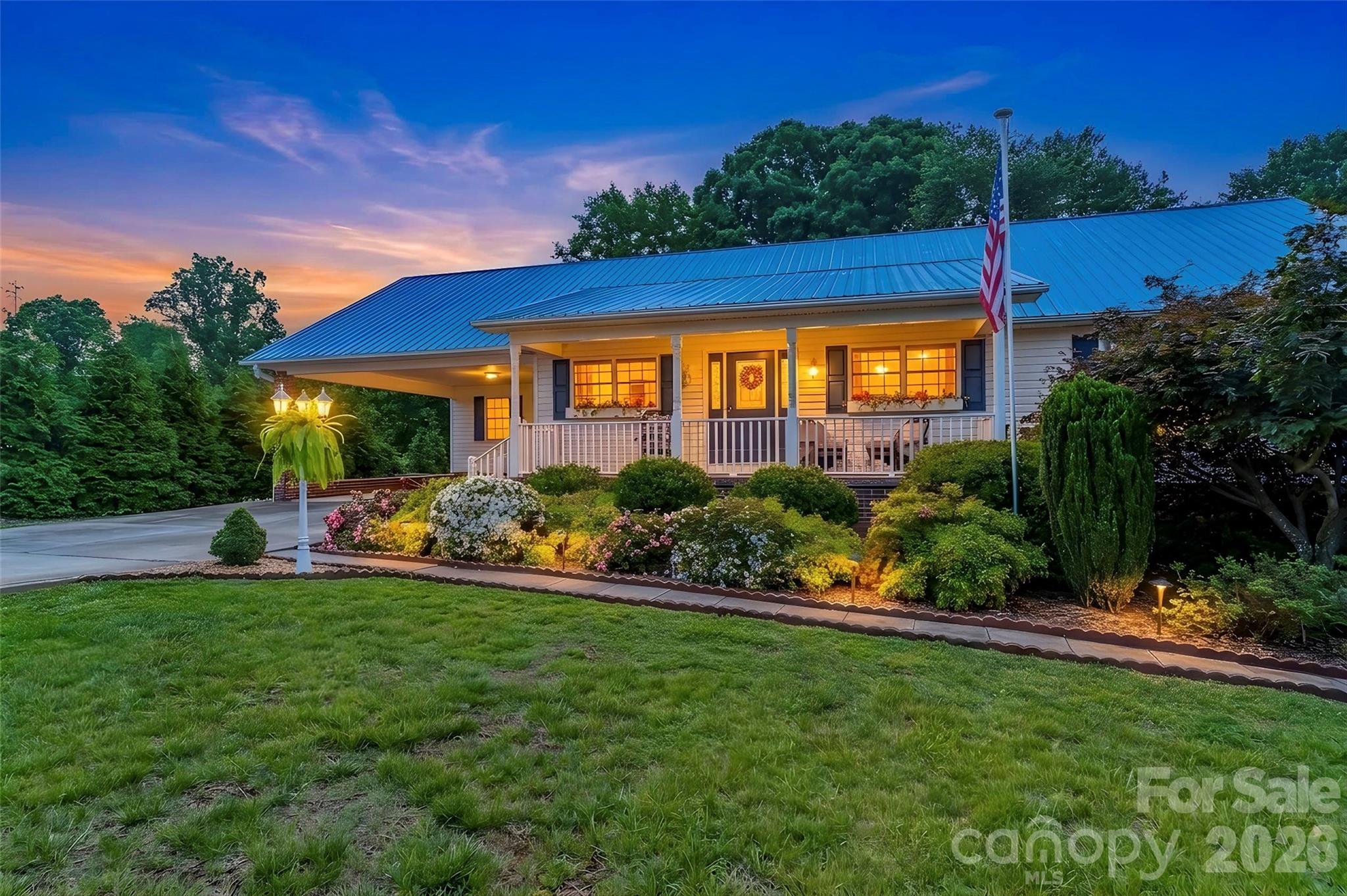 Absolutely stunning, sprawling 3BR/4BA home with a full, finished basement, potential mother-in-law suite, and a gorgeous, fully fenced backyard! Easily make this incredible home your "forever home" with all this space and storage! Beautiful hardwoods flow throughout the main level. Kitchen features bar seating, new oven, spacious pantry and ample counter space. The open floor plan flows into the large dining area and large living room. The sunroom offers an incredible additional space to relax and features a bright and open loft, perfect for a yoga room, reading room or office! Entry area to the second bedroom/attached full bathroom on the main floor features a dining nook and kitchenette, making it the perfect mother-in-law suite! Primary bedroom features large walk-in closet and a large primary bathroom with soaking tub. Third bedroom and third full bath located on the main level. Large laundry room offers storage and a convenient location on the main floor. Fully finished basement features a great bar area, rec room, office area, multiple storage closets, full bath, laundry hook-up and potential media room. So much space and so many ways that it can be customized! Basement opens onto a large covered patio and features a second gravel driveway that wraps around directly to the basement entry. Basement also offers garage area with built-in tool benches and storage. Main level features a spacious deck that overlooks the backyard. These beautiful 1.34 acres are fully fenced and have been sectioned into two areas, with the second fenced lot home to chickens and a covered car/storage area. Beautiful, mature landscaping surrounds this home, two driveways offer ample parking and the rocking chair front porch has been freshly painted! Owners have used the basement with it's own dedicated driveway and entry as an AirBnB and income reports are available.