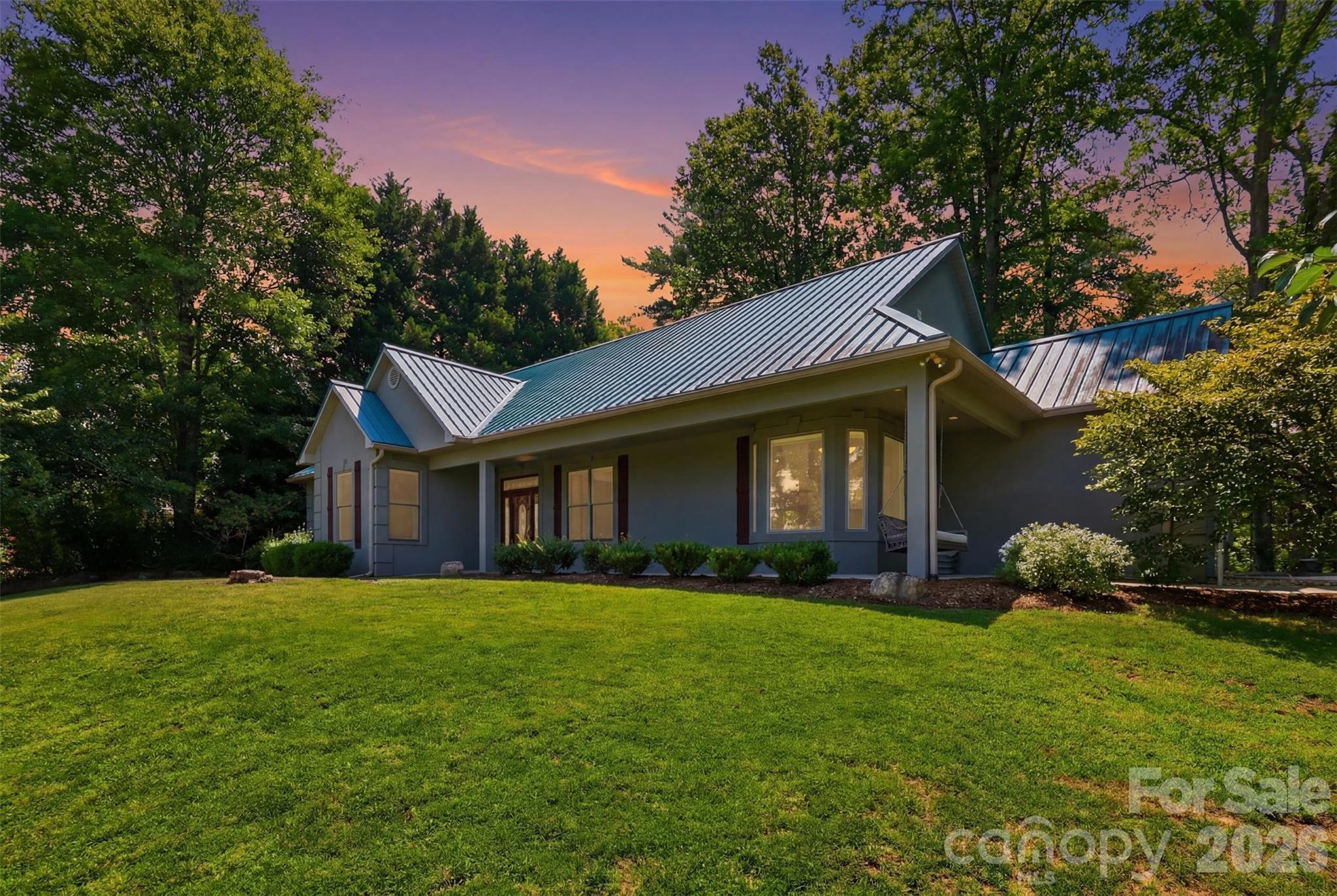 *Primis Mortgage is offering lender credit, equal to 0.5% of the mortgage loan amount, to all qualified buyers.* If you've been looking for mountain views, Lake James access, and room for everyone to spread out, this East Shores home delivers.

Located just second row from Lake James in one of the area's most sought-after communities, this 4-bedroom, 3-bathroom home offers stunning views of Table Rock and the surrounding Blue Ridge Mountains along with access to the amenities that make East Shores such a desirable place to call home. Residents enjoy deeded boat slips for non-waterfront properties, a community pool, multi-use sports court, and a welcoming neighborhood atmosphere just moments from the lake.

Inside, the main level features an open yet thoughtfully designed layout with tall ceilings, built-ins, a dining area framed by classic columns, and a light-filled kitchen designed for everyday living and entertaining. The living room and primary suite both open onto the recently updated TREX deck, creating seamless indoor-outdoor living.

Conveniently located just off the main living area, the primary suite includes deck access and a well-appointed bath with a dual vanity and glass shower. Two additional bedrooms, another full bath, and laundry complete the main level.

Downstairs, the home's renovated lower level has been transformed into a fully functional second living space. Complete with a full second kitchen, dining area, spacious living room, bedroom with en-suite bath, craft room, bonus room, and private walk-out access, the lower level offers exceptional flexibility for multi-generational living, extended guests, or potential income-producing opportunities.

Recent improvements include fresh interior paint, professionally stripped and resealed tile flooring, updated landscaping, and continued care throughout the property.

Located approximately 12 minutes from Lake James State Park, 18 minutes from Downtown Morganton, and about 90 minutes from Charlotte, this home offers the perfect balance of mountain living, lake recreation, and everyday convenience.

Whether you're looking for a full-time residence, mountain retreat, or a home designed for hosting family and friends, this property offers the space, flexibility, and Lake James lifestyle that's becoming increasingly difficult to find.
