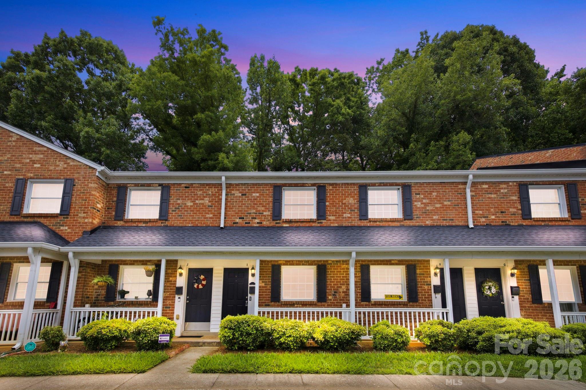 Some places just feel right the moment you walk in and this is one of them. This full brick beauty, built in 1965 and thoughtfully modernized, delivers the kind of low maintenance lifestyle that lets you enjoy the neighborhood you worked so hard to land in. It is the rare combination of character, convenience and community that most people spend years searching for. The moment you pull up, the charming front porch draws you in and practically begs for a slow morning coffee. Out back, your patio with privacy fencing and a locking storage closet becomes your exhale at the end of a long day. Tucked away, quiet, entirely yours. Inside, the open layout feels warm and welcoming. The kitchen shines with upgraded maple cabinets, granite countertops and a stainless appliance package. A breakfast bar bridges the kitchen and dining area perfectly, making everything feel connected and easy. The generously sized living room stretches across the rear of the home with a wall of windows that practically pulls the outside in. It is the kind of space that works equally well for a Netflix binge or a dinner party you never want to end. Upstairs, two bedrooms offer their own distinct personalities. The primary suite features a walk-in closet and a bright front facing outlook. The second bedroom looks out to a calming tree line that makes the city feel beautifully far away, even though it is not. A full bath with serious counter space and an upstairs laundry setup round things out in the most practically perfect way. And then there is the location. Just over a mile from the breweries, restaurants, coffee shops, and green space that give Plaza Midwood its unmistakable pulse. Affordable. Charming. Completely move-in ready. Don't sleep on this one!