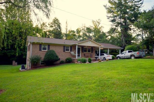 This cozy and inviting brick ranch is sitting pretty on a nicely landscaped 2 acre tract! The spacious living room has hardwood flooring & a gas log fireplace. The eat-in kitchen also has hardwood flooring, solid surface countertops, and french doors leading out a 6x40' deck. The carport is oversized offering 675' of parking space. The basement level would be perfect for an in-law suite or would be great for teenagers as well. It has a nice den, bedroom, full bath, eating and laundry area, and is tastefully decorated. There's plenty of parking & easy access to the basement level if a private entrance is desired. The laundry area would be the perfect place to add a small kitchen. The woodstove offers an alternative source of heat or a great occasional supplemental heat. The detached double garage and workshop has 1087' of space w/ unlimited possibilities. This is a great property and rare find given the acreage, big garage, ample parking, and location in the southern end of the county!