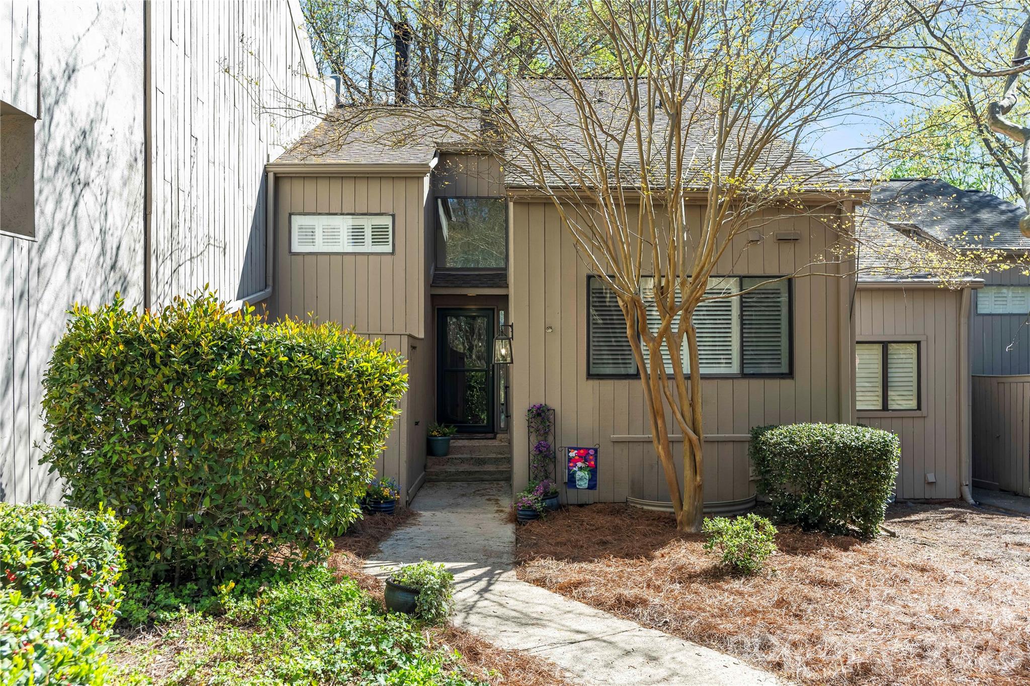 This 4-bedroom, 3 full-bath home offers the perfect serene setting to create your own lake life retreat. Filled with natural light, the home features beautiful hardwood floors on the main level, an updated primary bathroom and main-level bath, and plantation shutters that add charm and a relaxed, vacation-like feel.

The lower level offers a screened-in porch surrounded by mature trees and greenery that are perfect for enjoying peaceful mornings or unwinding at the end of the day. Convenient parking just steps from the front door makes everyday living easy.

Located within walking distance to the community pool and dock, this home also gives you access to everything River Hills has to offer, including 24-hour gated security, golf, marina access, a private three-acre beach on the lake, community garden, dog park, playground, and sidewalks.

With low York County property taxes and true low maintenance living, this is an ideal opportunity to enjoy the lake lifestyle with ease.
