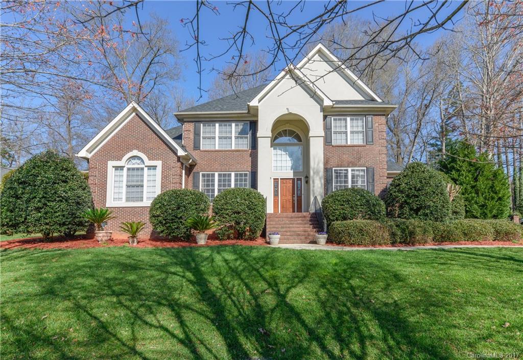 Located in one of Fort Mill's most desirable communities of established homes & larger lots.  Here, well built homes are not a thing of the past & this one has all the “I wants” you’ve been looking for . . . full brick, custom built, 3 car garage, master & 2nd BR down, den, loft, bonus . . . the list goes on.  Don't miss your chance to enjoy summers on the covered porch surrounded by generous trees & a flat backyard that can accommodate a pool, trampoline or swing set.  This home demands action!