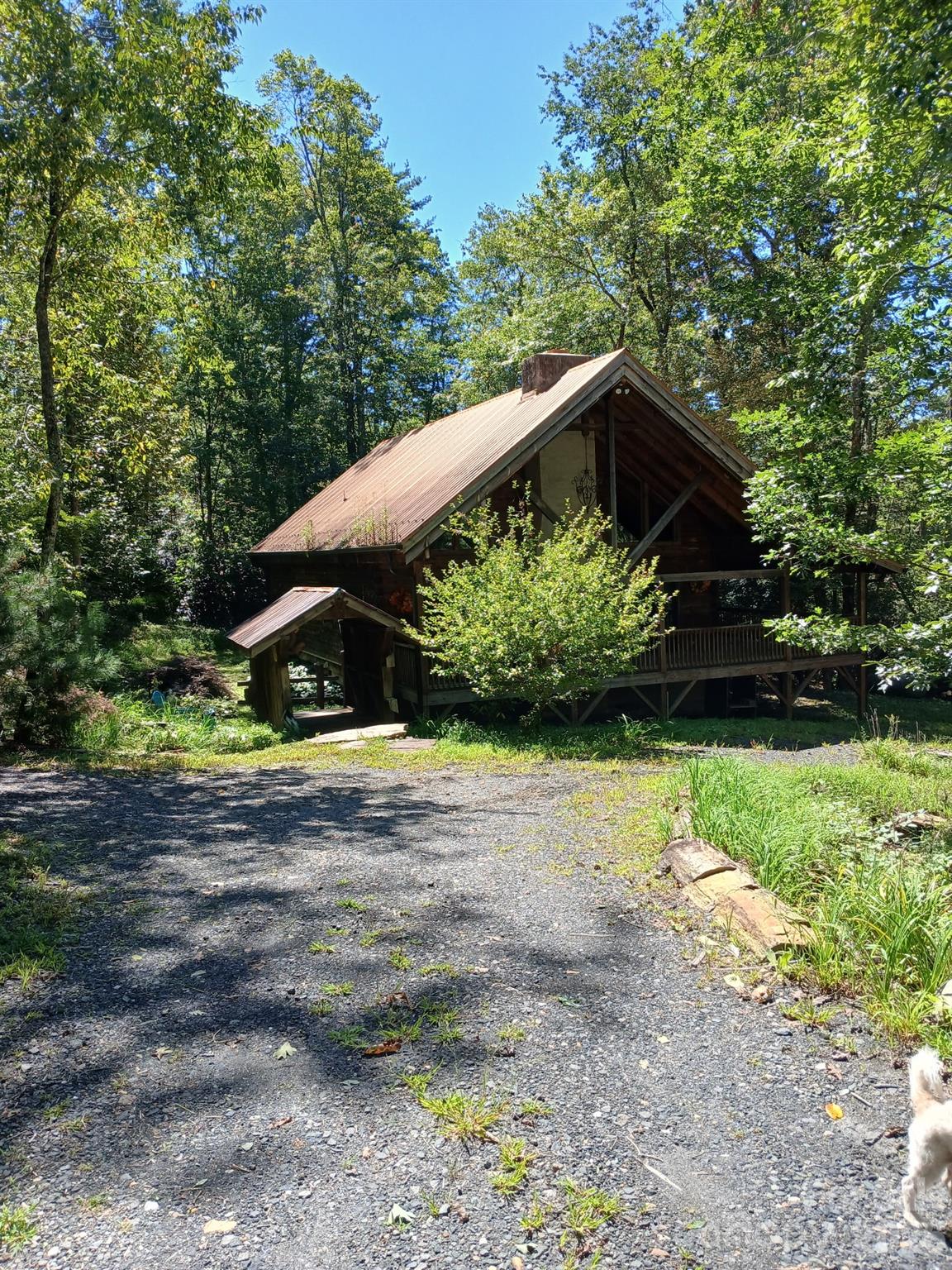 Tucked away in the peaceful mountains of Spruce Pine, this inviting property offers privacy, natural beauty, and the charm of true mountain living. Located just minutes from the Blue Ridge Parkway, 1964 Humpback Mountain Road provides a serene setting surrounded by mature trees and fresh mountain air. The home features a comfortable layout with warm, welcoming living spaces and abundant natural light. Enjoy quiet mornings on the porch, cool summer evenings, and the sounds of nature year-round.
Ideal as a full-time residence, second home, or mountain getaway, this property offers the perfect blend of seclusion and convenience with easy access to downtown Spruce Pine, dining, shopping, and outdoor recreation. Experience the tranquility and scenery that make Western North Carolina so special.