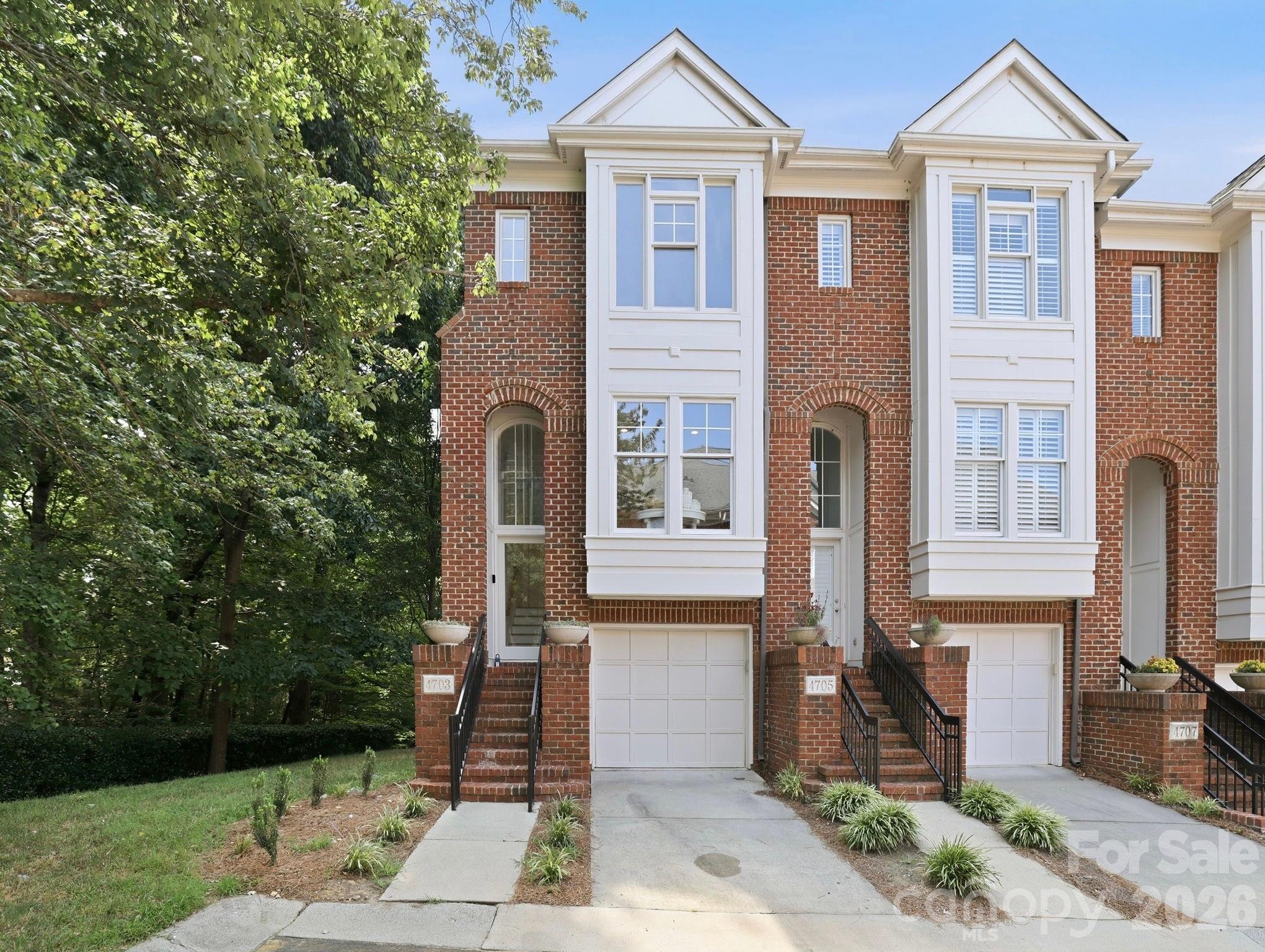 Completely renovated, this exceptional end-unit condo in SouthPark's coveted South Hill community offers a rare blend of modern design, thoughtful upgrades and an unbeatable location! Tucked along a quiet, tree-lined street, this light-filled 2 bedroom/2.5 bath home has been meticulously transformed with brand-new hardwood floors, fresh interior paint throughout (walls, trim, doors AND ceilings!), new appliances and a surround sound system on the main level that is wired to extend to the private outdoor patio. The open-concept floor plan is designed for both everyday living and effortless entertaining, seamlessly connecting the sleek, updated kitchen with the dining room and spacious living room, which is anchored by a gas fireplace for cooler nights. Upstairs, both bedrooms provide a peaceful retreat, including a spacious primary suite with an en-suite bath, along with a full secondary bath and conveniently located laundry. Outside, you will find your own fenced-in private patio, perfect for relaxing or entertaining. Residents also enjoy access to the community pool, while the HOA includes water for added value and peace of mind. Just moments from Whole Foods, Starbucks and some of Charlotte's premier shopping, dining and entertainment, this truly move-in ready home offers luxury, convenience and one of SouthPark's most desirable addresses!
