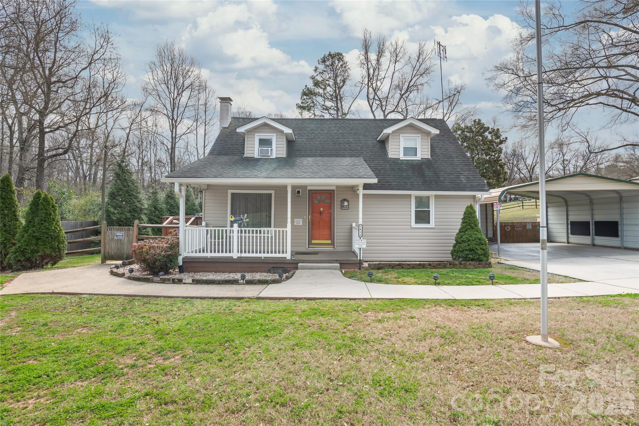 Rare opportunity in Fort Mill—this cozy, well-maintained home sits on a spacious acre lot with no HOA, offering flexibility and room to grow. Featuring an updated bathroom and walk-in closet in the primary bedroom, this property blends comfort with everyday functionality.

Enjoy the fenced backyard, wired workshop with cabinets and workbench, and a carport for covered parking. The back porch and composite deck provide the perfect setting to relax and take in the natural surroundings. With great curb appeal and a layout that highlights the home’s placement on the lot, this property has been thoughtfully cared for over time.

The kitchen has been updated with granite countertops, new flooring, backsplash, and cabinet lighting, and includes a gas range, dishwasher, refrigerator, and washer/dryer. A whole-house water filtration system is also in place.
Updates include newer siding and gutters (2023), windows (2014), HVAC with updated ductwork (2016), plumbing improvements, upgraded electrical service, and insulation with vapor barrier in the crawl space. Additional features include updated driveway and carport, workshop with power and lighting, outdoor lighting, and more.

Location, location, location—conveniently situated near top-rated Fort Mill schools, shopping, dining, and with easy access to major roadways.

Additional highlights include outdoor lighting, workshop storage and built-ins that remain, and a transferable termite bond with Okin. 

A unique property offering space, updates, and convenience—don’t miss this Fort Mill find.