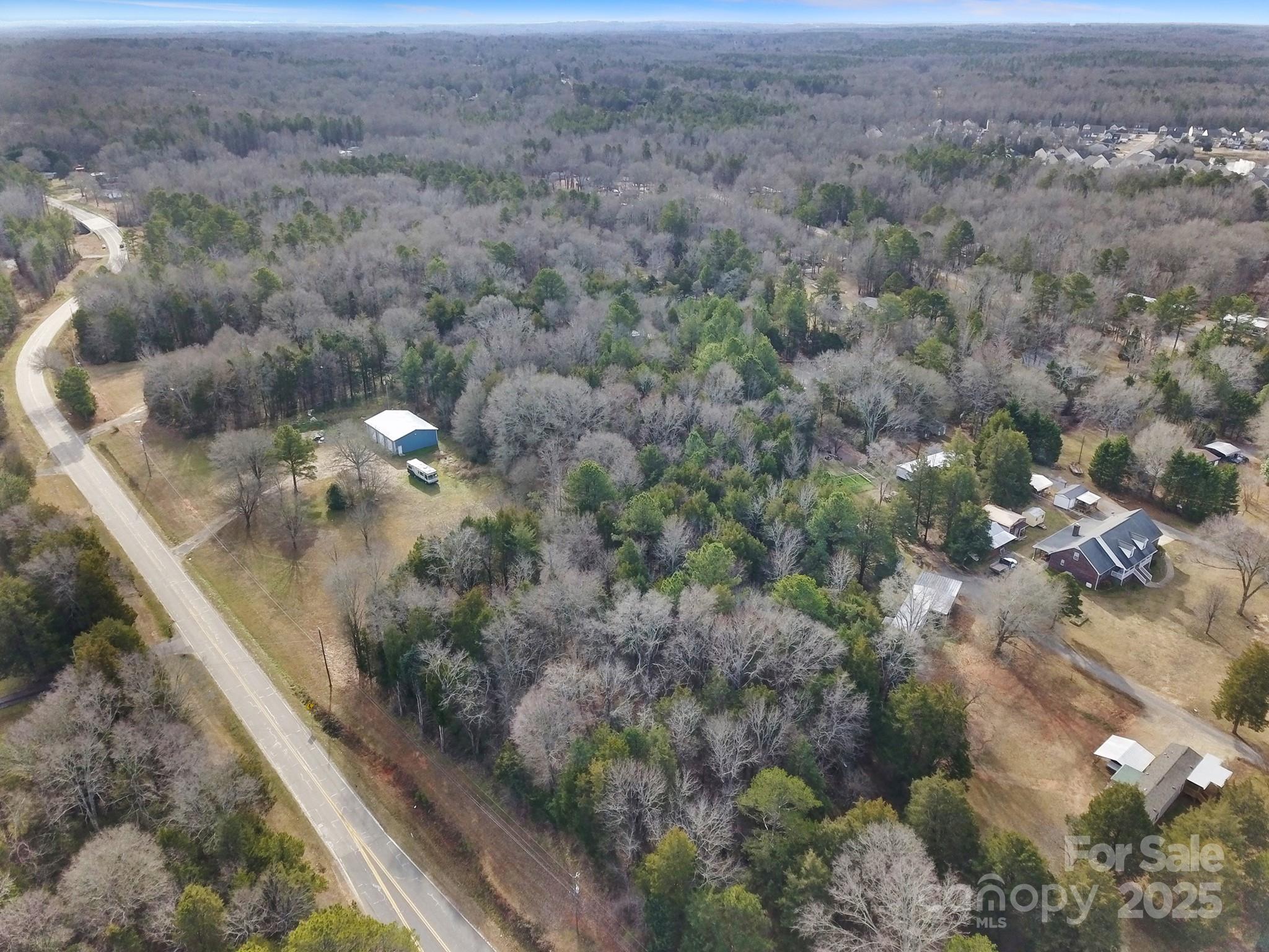 2000+/- of prime road frontage on Church Rd. in Rock Hill, SC primed and ready for plan submittals to the City of Rock Hill, SC for a development or amazing tracts to combine and make one or several homesteads in ear shot of the City of Rock Hill, SC. Less than one mile off Dave Lyle Blvd and the amazing convenience of I-77, shops, stores, restaruants and one of Rock Hill, SC. main exits! Attached are plans the seller has already done with a local engineer with different site plans. The site is fantastic and would even balance with development purposes according to the engineer. There aren't many amazing opportunities this close to all Rock Hill, SC has to offer with city utilities! The listing agent has worked closely with the seller on the site plan and city of Rock Hill, SC so far and can answer specific questions.

There are four parcels total in all:

700101106 - 1261 Church Rd
700101107 - 1255 Church Rd
700101108 - 1085 Church Rd
700101109 - 1069 Church Rd