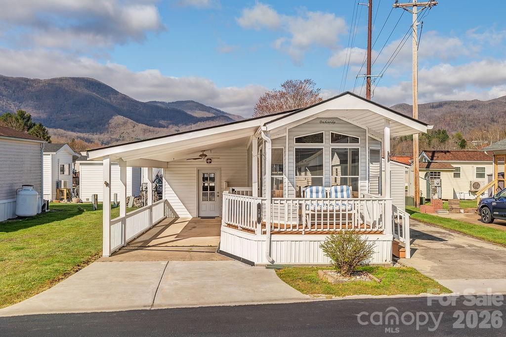 Enjoy peaceful mountain living in this charming park model home located in the desirable 55+ community of Summer Place. Conveniently situated just off Jonathan Creek Road, this property features paved access and is surrounded by well-maintained homes.
    There is no lot rent, as you own the land, along with low HOA fees of just $100 per year. The home has been recently updated creating a fresh, inviting space, and it comes fully furnished for a truly move-in-ready experience.
    This rare property offers two concrete driveways, a carport, covered porch, and a spacious wraparound deck. Additional features include a dedicated laundry room and an extra storage shed for added convenience.
 A perfect blend of comfort, value, and scenic beauty—this home is ready to welcome you.
     Financing available through 21st Mortgage.