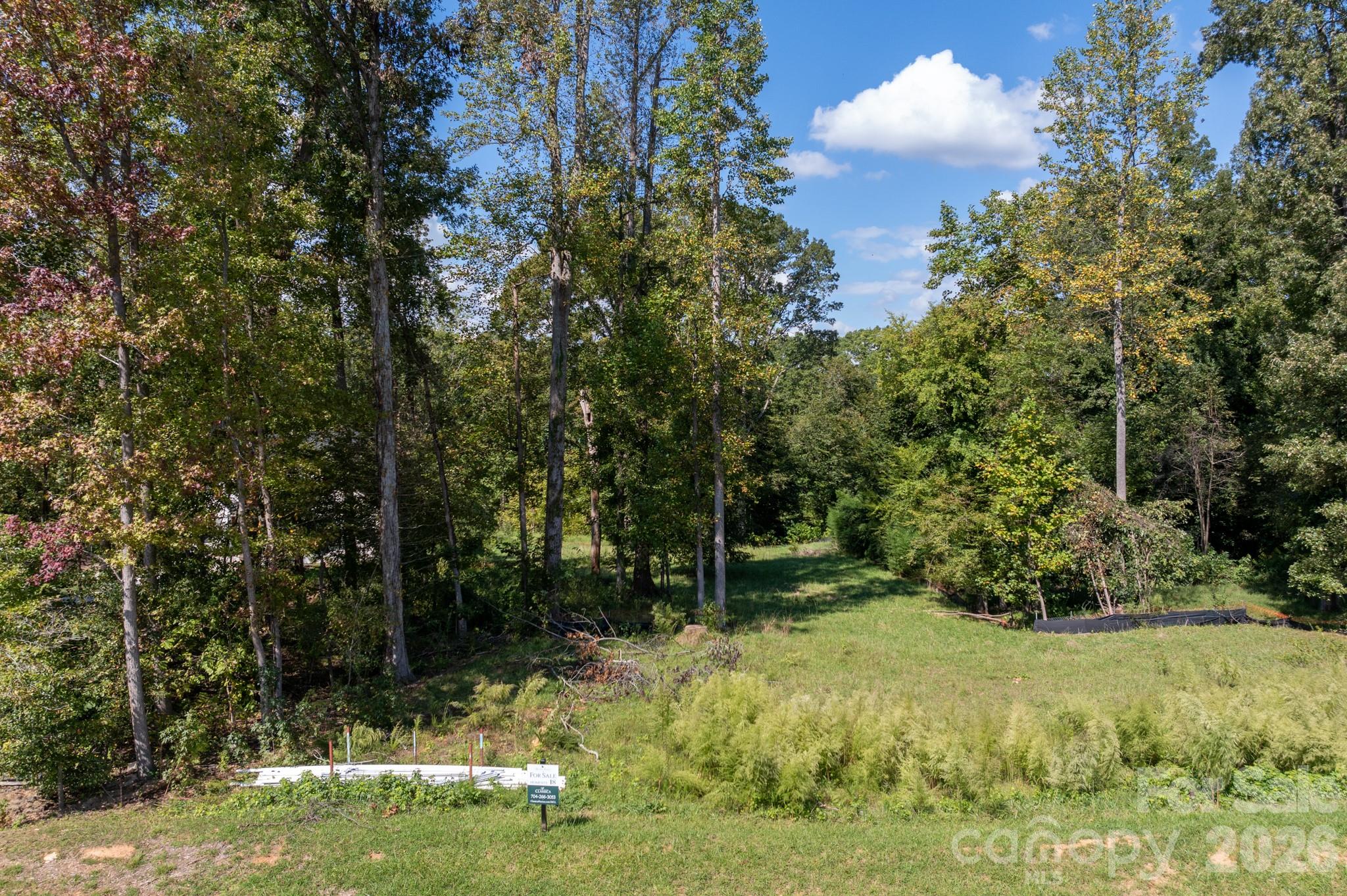 A rare opportunity to build a brand-new home in one of the Lake Wylie area's most exclusive
enclaves. This 1.01-acre wooded homesite is one of only 22 estate-sized homesites in Hunts
Point, an intimate community tucked along the shores of Lake Wylie in Belmont, NC. Located
on a cul-de-sac street with no through traffic, the homesite offers exceptional privacy and the
space to create an estate-caliber property that is genuinely difficult to find in today's market.
This is a land sale with a required build agreement. Buyers select from a curated collection of
architect-designed floor plans and personalize their home's finishes, fixtures, and selections
through an on-site design studio — delivering a truly personalized new home experience without
the complexity of a full custom build. Available floor plans range from approximately 2,900 to
over 4,600 square feet, with pricing from the $1.6M range including lot. The flat-to gently-
rolling grade of this homesite accommodates a full range of plan options with no
basement requirement.
Residents enjoy direct access to over 10 miles of community trails that connect to an additional 5
miles of pathways through Seven Oaks Preserve — a 2.8-mile shoreline trail running alongside
the Daniel Stowe Botanical Garden. The McLean Marina and waterfront dining are also within
easy reach, making everyday life feel like a retreat.
Conveniently located just minutes from charming Downtown Belmont with its local shops and
restaurants, and easily accessible from both I-85 and South Charlotte via I-485. Served by
Gaston County Schools including New Hope Elementary, Cramerton Middle, and Southpoint
High.
Side-load garage configuration available. Do not walk the lot without a scheduled appointment.
Contact listing agent for available floor plans, site plan, and build program details.