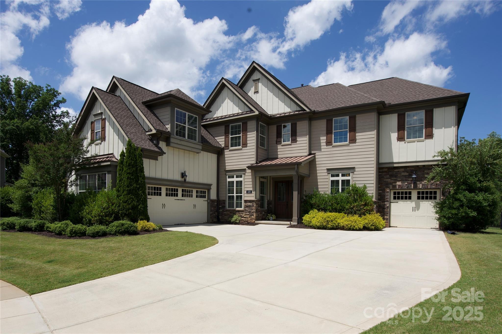 MAJOR PRICE IMPROVEMENT. DON'T MISS THIS OPPORTUNITY. Located on a cul-de-sac in the highly desired Springfield community featuring a grand 2-story foyer w/curved staircase, 2-story Great Rm showcasing a stacked stone, gas fireplace surrounded by built-in bookcases. Open floorplan. Gourmet Kitchen, farm sink in oversized island, walk-in pantry & drop zone. Wet bar area w/wine ref. leads to your Formal Dining Rm. Front Office. Bedroom/Flex Rm w/ensuite bath. Powder Rm. Triple sliders lead to your screened porch w/stone, gas fireplace. Upstairs boasts 5 BR's, 3 BR's w/ensuite baths + full Hall Bath, Loft area. Large Laundry Rm. Primary BR w/2 walk-in closets, vanity area. Primary bath w/soaking tub, walk-in shower w/rainfall & wall jets. Almost 1/2 acre private, fenced lot w/irrigation. Split 3 car garage w/utility sink & epoxy floor. Springfield offers tennis courts, 3 pools, pickle ball, playgrounds, walking trails, and an Anne Springs Greenway membership.