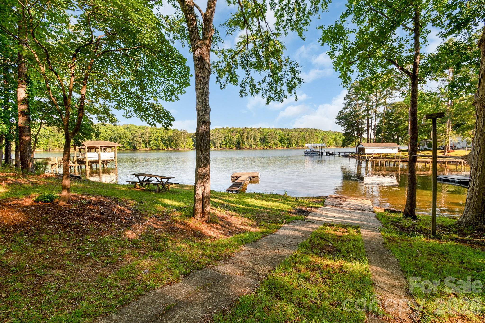 Beautiful waterfront retreat on Lake Wateree! Nestled in a quiet cove on Singleton Creek just off the main water, this charming 2 bedroom, 1 full bath property offers the perfect lake getaway. Enjoy peaceful mornings and relaxing evenings from the screened-in porch overlooking the water. The floating dock makes it easy to spend your days boating, fishing, or simply soaking up lake life. Located outside of the flood zone with gorgeous water views, this property offers the convenience of nearby access to Wateree Marina and Lake Wateree State Park by water. Whether you’re looking for a weekend escape, investment opportunity, or full-time lake living, this one is a must-see! New well, water heater, an plumbing in 2025.