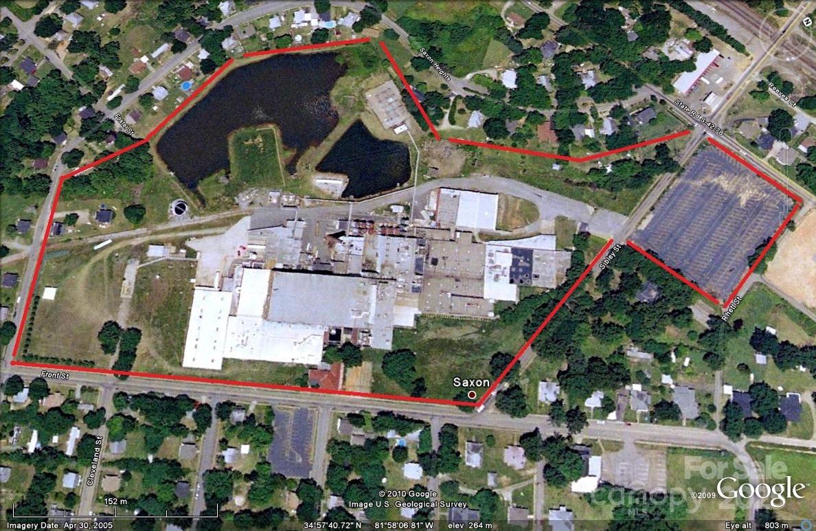 27 +/- acres corner lot commercial property previously the Saxon Mill Textile Plant. Excellent owner/investor opportunity. Prime location/visibility within less than 1 mile to I-85 and I-26, 2 blocks of the Methodist University, Approx. 2 miles from Spartanburg Mall, the hospital, Wofford University and Converse College.Various Tax Credits & Incentives may be available with the property including the New Market Tax, South Carolina Textile Communities Revitilization Act, Historic Preservation Tax Incentive, Federal Income Tax Credit for Low Income House, State Historic Rehabilitation Tax Credit.  Commercial utilities are available. 27+- acreage. Property consists of two fire ponds. One 2+- acre and one 5 +- with natural habitat established. Philips Conco monitors well sites which currently pays the owner 22K per year. Approx. 92K sq ft of warehouses, shop 50x100, and add'l bldgs.