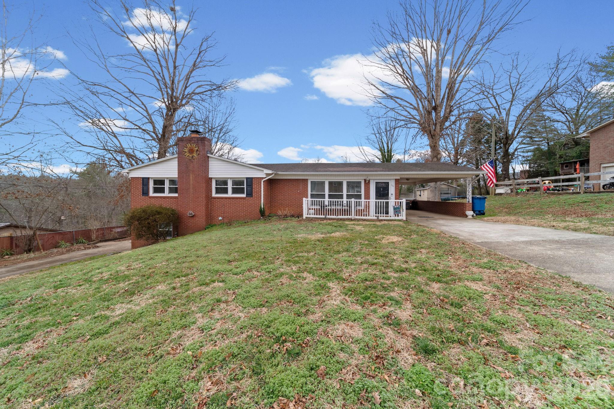 **116 Hilltop Avenue, Valdese, NC 28690-9764**

Tucked in a sweet spot between Valdese and Morganton, this classic brick ranch delivers space, updates, and that hard to find no HOA freedom on a beautifully maintained .45 acre fenced lot.

With over 1900 square feet, this 3 bedroom, 2 bath home offers comfortable main level living plus a partially finished basement with room to grow. The main level features hardwood floors, large bedrooms, fresh paint, and a spacious living room. The kitchen and dining area flow openly together and showcase beautiful oak cabinetry, plenty of storage, and a new stove, making everyday living and entertaining feel effortless.

Downstairs, you will find a heated and cooled bedroom, new plumbing and electrical updates, plus additional space ready to be finished to suit your needs. The basement was originally built in 1963 and offers flexibility for recreation, storage, or expansion. 

Major updates provide peace of mind, including a Goodman 14 SEER heat pump installed in 2023, septic cleaned in 2023, and new hot water heaters. 

Step outside to enjoy the beautiful front porch, large back deck perfect for gatherings, and a storage building for tools and hobbies. The carport adds everyday convenience.

Located close to McGallard Park and positioned perfectly between Valdese and Morganton, this well cared for home blends charm, updates, and opportunity all in one inviting package.