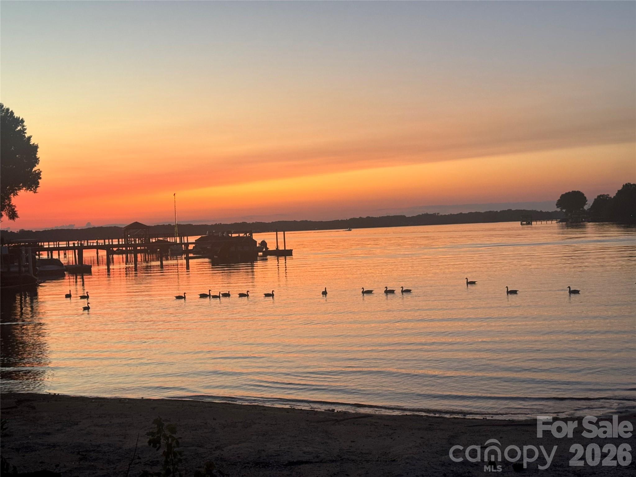 Incredible, vast, waterfront views, from one of the last, pristine lots on LKN. The hallmark of this Modern English Arts & Craft hm has abundance of natural light, showcasing long range views & offers the newest design features. The experience begins w/custom made arched front door & its openness, to the 12’ white oak beamed ceiling @ family/dining rm. Kitchen w/com appliances, quarter sawn white oak island & 12’ ceiling. The primary suite, features private outdoor courtyard that serves as a conduit of light from the bath & bedroom, while maintaining beautiful views. Retire to the lounge w/guests, where the entertainment bar & wine cellar are a key feature. Travel upstairs, via the stair tower, to 3 large en suites w/large views. The upper floor enjoys a library & bonus rm.  No HOA!! Don't miss this rare opportunity to build your dream home on LKN! This home is a proposed floorplan & design, according to specs, adjustments can be made as needed/desired.  There is also an additional land/lot listing for this parcel and can be viewed using MLS#4397397.  The land/lot listing is for $2,300.00 and can be purchased separately.  The last five photos are historical photos shortly after Lake Norman was built.  The barn currently on the property was built in 1956, and the property has remained in the family since before the barn was built.  This is a great opportunity to purchase some very special waterfront.