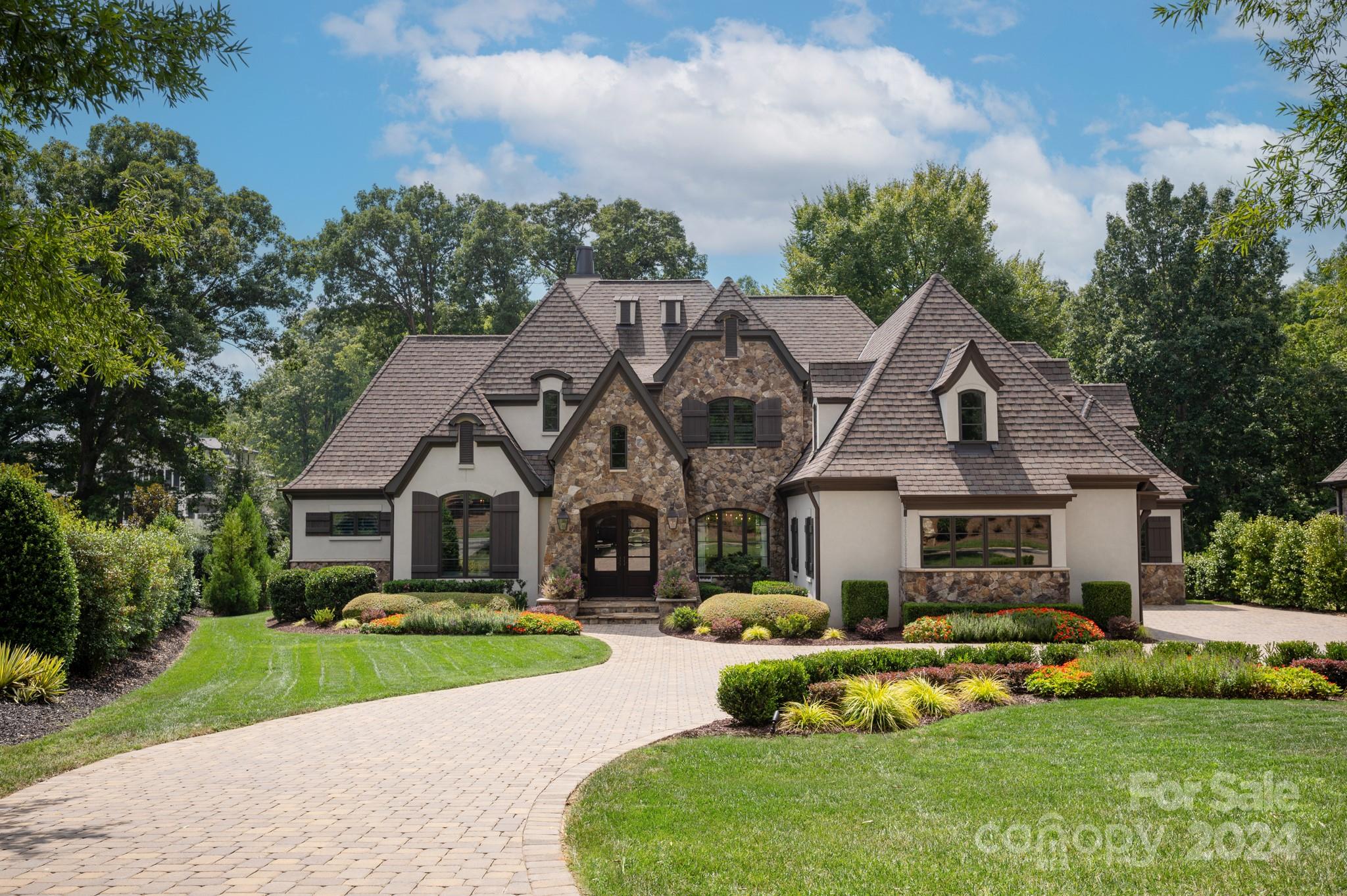 Luxury Custom Residence with panoramic golf course views located in desirable gated Longview Country Club. This dream home features amazing design upgrades throughout. Gourmet kitchen boasts cultured quartz counters, Sub Zero 42" refrigerator, 48" Pro Designer series Thermador gas range with steamer & griddle,  and best of all hidden door leading to over sized scullery/pantry with 2nd dishwasher and refrigerator. Collapsible sliders create an open/airy family room that spills onto back covered terrace with retractable screens overlooking the spectacular pool, spa and large gas built in fire-pit and view of golf course. Luxurious master suite with vaulted ceiling, golf views and master bath adorned with marble counters & shower with barrel ceiling detail and closet washer/dryer hook up. 4 en-suite bedrooms upstairs with bonus room with built bar and laundry/craft room. Security w/keyless entry. Membership includes golf, tennis, swimming, dining, fitness center and more.