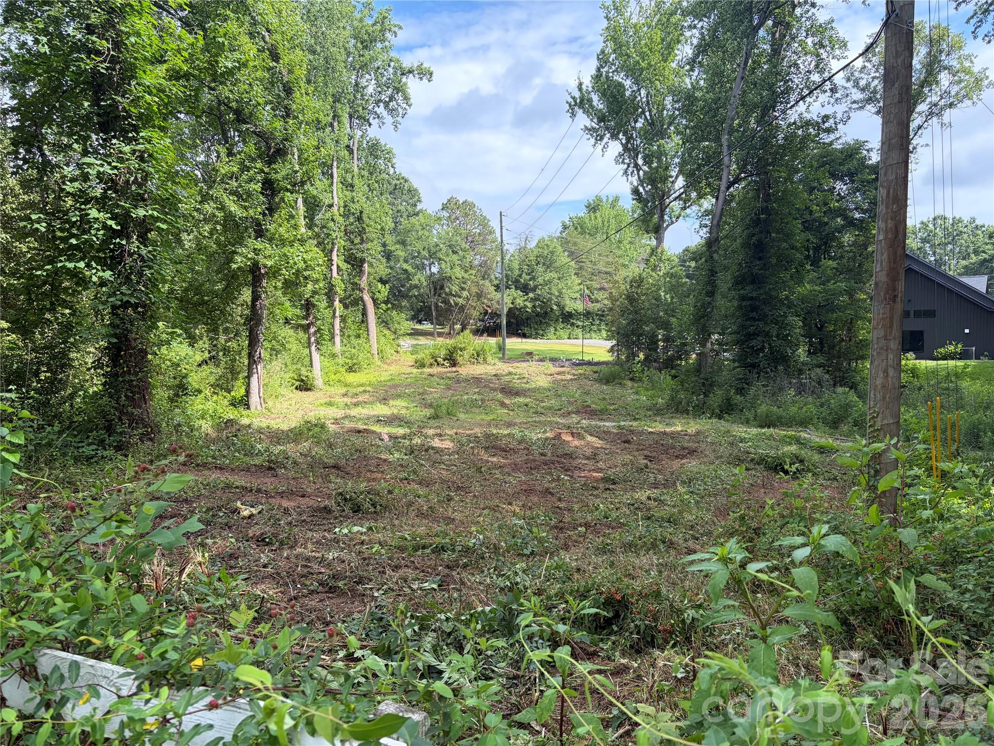 Large Rectangle Lot consisting of 3 acres. Mature Hardwood Trees, Great for Privacy, Creek on Backside of Property, New Homes next door, Come see and Build your Dream Home! No Restrictions, No HOA. Preliminary soil and site Evaluation also completed, Septic permit for 3 bedroom. May be able to have more bedrooms, but seller only needed 3. Paperwork on file, Close to Troutman off Amity Hill Rd or Statesville side off 70. Great Price, Great Lot, Bring your Builder!