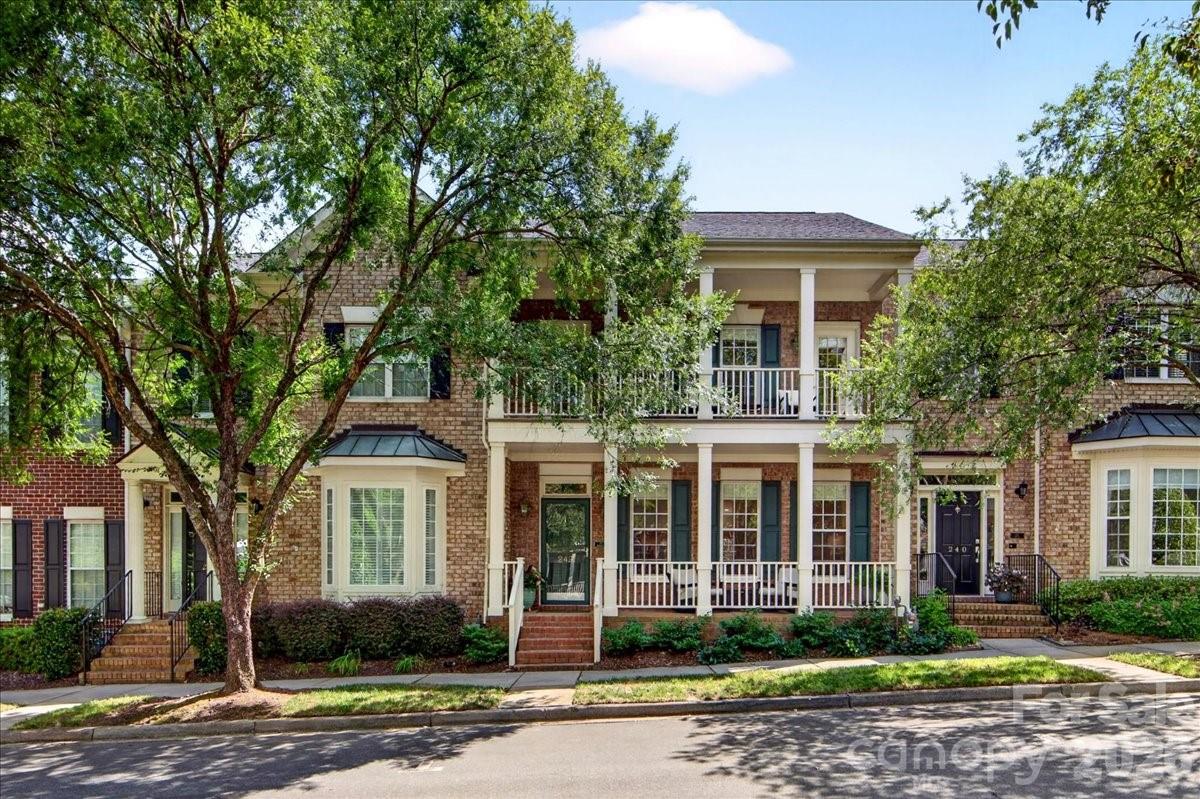 Charleston-style townhome with two wonderful porches and a casita (small living area over the garage) nestled among the tree canopy in the highly desirable St. Albans neighborhood of Davidson. This beautifully updated home features 3 bedrooms, 2.5 baths and a main-level primary suite plus another bedroom, full bath & kitchen in the casita with its own separate entrance. Thoughtful upgrades throughout include Core Tec luxury vinyl plank flooring, custom Elfa closet systems in every closet and an enlarged opening between the living room & kitchen that creates a more open, inviting floor plan. The extensively renovated kitchen is a standout, featuring a custom double island with storage on both sides, quartz countertops, a French door wall oven, microwave/convection oven, induction cooktop, Kohler Prolific workstation sink with premium accessories, stand mixer lift and a modified pantry with a built-in charging station. The primary suite offers custom closet organization, including jewelry drawers, while a dedicated third HVAC zone & thermostat provide enhanced year-round comfort. Additional improvements include a tankless gas water heater (2019), new HVAC system for the townhome (2021), new HVAC system for the casita (2025), a two-car garage, and an assigned parking space behind the unit. Less than one mile from Main Street and Davidson College, this home is located on tree-lined S. Faulkner Way overlooking a beautiful green space. St. Albans' grounds are meticulously maintained and offer exceptional walkability with sidewalks, streetlights, pocket parks, a playground, dog park and the beautiful Faulkner Square Green. The Japanese maple and container, along with the herb box, will remain with the property.