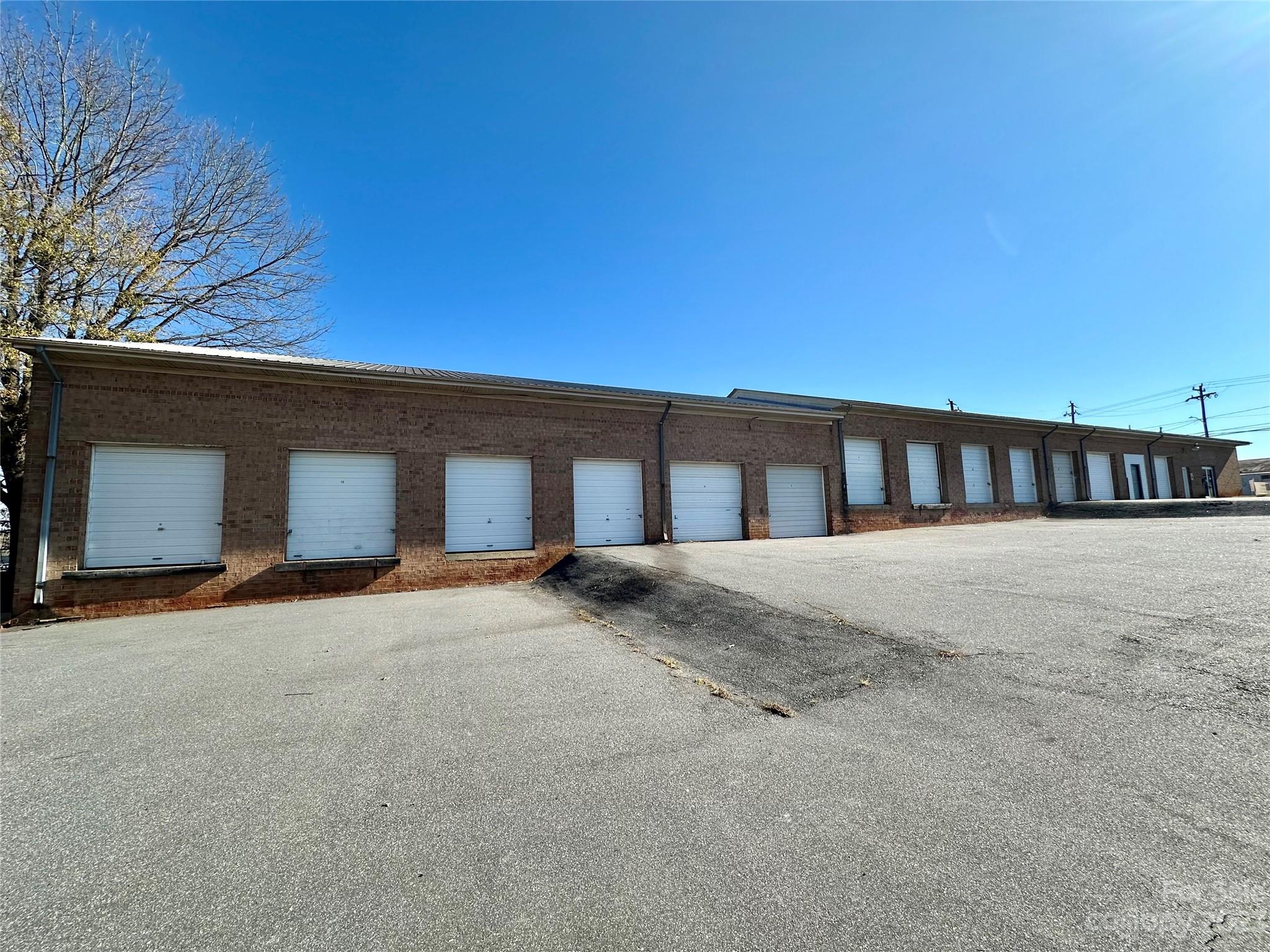 Commercial storage and retail storefront combined.  There are eleven 12'X40' storage units.  3 units are drive-in.  7 units are dock door loading entry.  One unit is closed-in as part of the front office/storage/retail area.  This section is heated and includes a men's and women's bathroom.  Storage doors are 9'X10' and 9X8'.