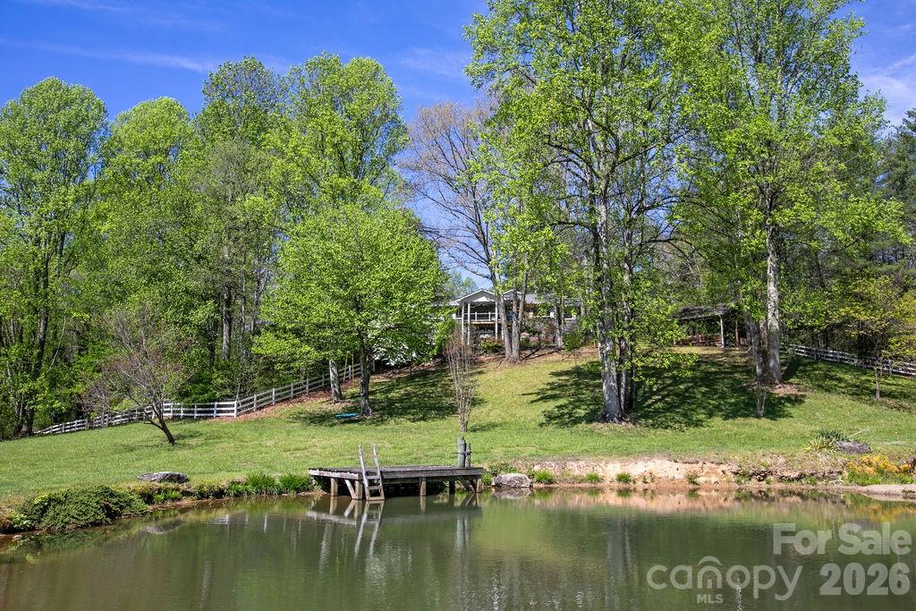CHECK OUT THE VIDEO LINK! Welcome to 1388 King Road in Pisgah Forest, NC—where refined country living meets convenience and outdoor adventure. Set on 4.81 picturesque, pastoral acres, this extensively renovated property offers 3,549 heated square feet of thoughtfully designed living space, blending modern style with functional flexibility.

The home features a stunning designer kitchen and beautifully updated bathrooms, showcasing quality finishes and attention to detail throughout. The spacious layout includes a fully functional lower level that can easily serve as an in-law suite or private guest quarters, offering versatility for multi-generational living, rental potential, or work-from-home needs.

Outside, the property is equally impressive. Enjoy a spring-fed pond, established fencing, a chicken coop, and multiple outbuildings—ideal for a mini-farm, hobby farm, or simply embracing a peaceful mountain lifestyle. The land is both usable and scenic, offering a rare combination of open pasture and privacy.

Location is a standout feature. Situated on the north side of Brevard along King Road, this property provides quick and easy access to Brevard, Hendersonville, and Asheville. You’re less than 20 minutes to Asheville Regional Airport, under 10 minutes to the entrance of Pisgah National Forest, and approximately 20 minutes to DuPont State Forest.

Whether you’re seeking a full-time residence, a mountain retreat, or a high-elevation hobby farm, this property delivers. Enjoy immediate access to world-class hiking, mountain biking, fly fishing, and endless outdoor recreation—all just minutes from your doorstep.

This is Western North Carolina living at its best.