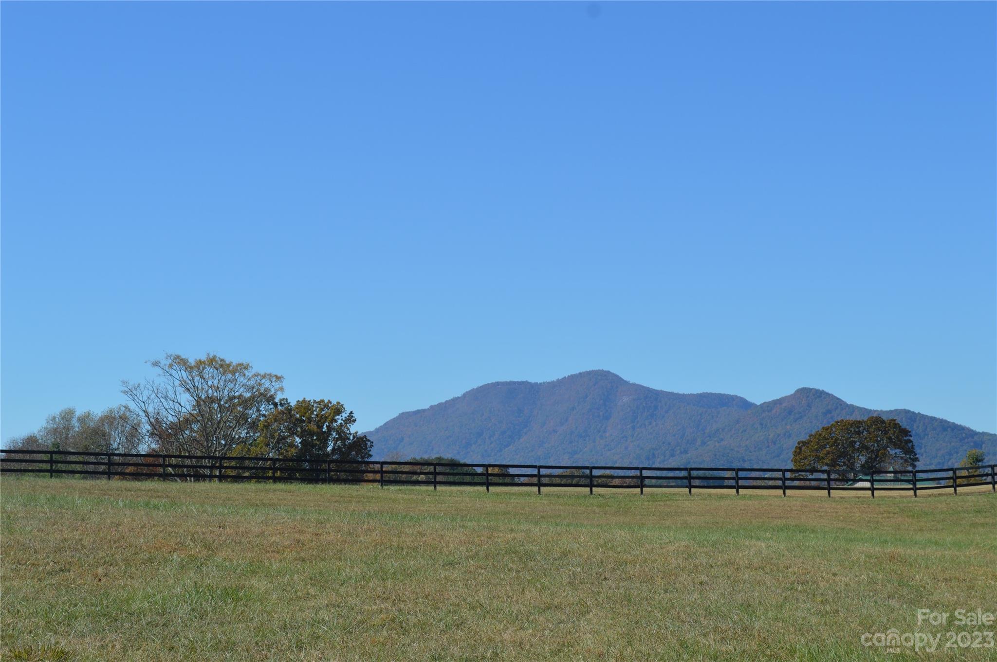 This extraordinary piece of land offers a picturesque view of the mountains, surrounded by lush pastures. Imagine waking up to breathtaking scenery every day!
What sets this tract apart is that it has already been approved for a 4-bedroom house, making it even more convenient for those looking to build their dream home. With trails weaving through the neighborhood, you'll have endless opportunities to explore and enjoy nature right at your doorstep.
While the HOA is pending, rest assured that this community is bustling with activity. Many lovely homes are currently under construction, creating a vibrant and growing neighborhood. It's an exciting time to be a part of this community and watch it flourish.
This rare find offers a clear canvas for you to bring your plans and get started on building your perfect home. Don't miss out on this incredible opportunity to own a piece of paradise in Tryon Equestrian Farms!