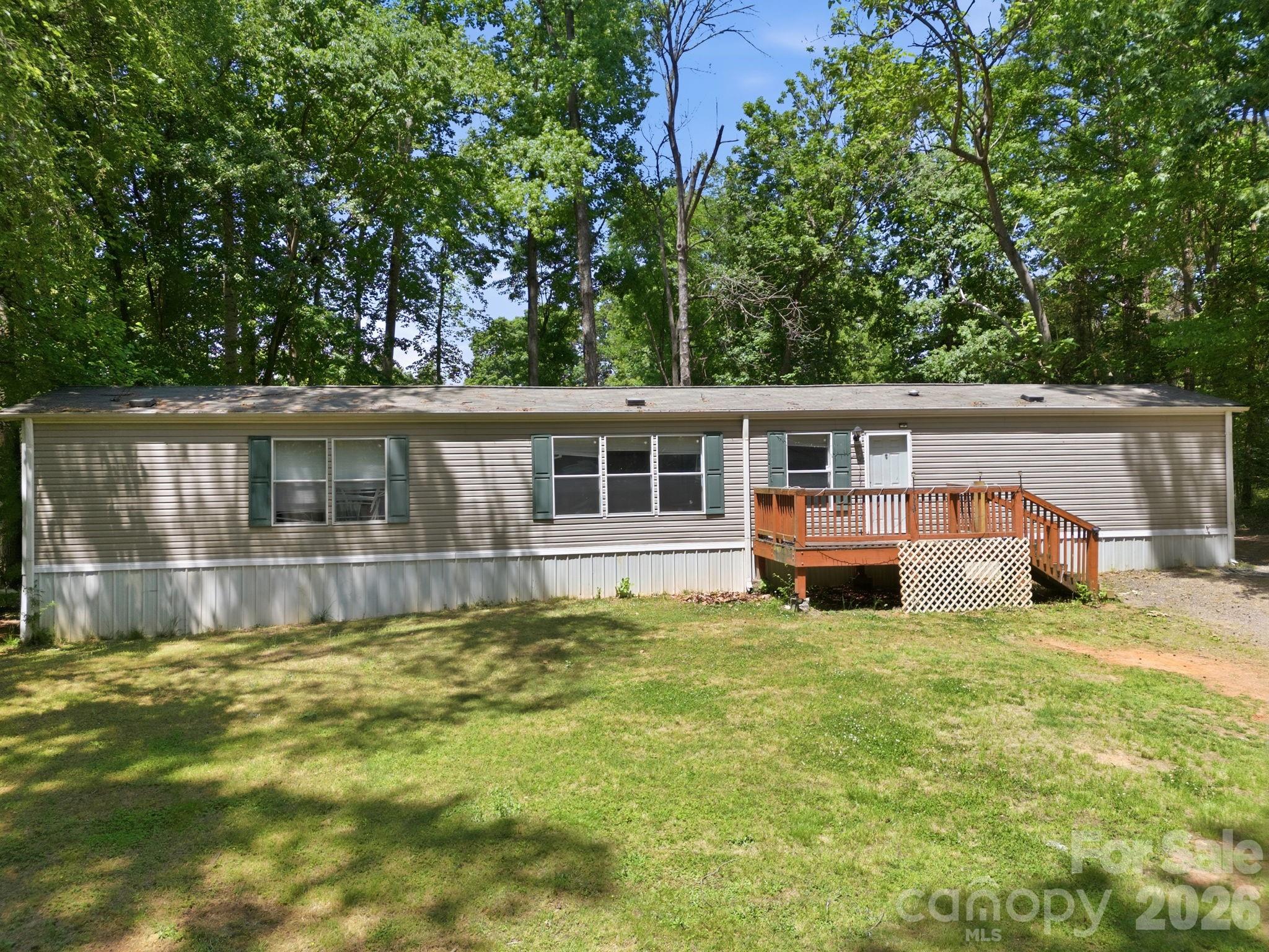 Move in ready 3 bed/2 bath manufactured home offers the perfect blend of space and peace of mind. Situated on a private, large lot, it features several high-ticket updates. NEW ROOF (2025) and newer HVAC system in last few years. The heart of the home is an open concept living area and a spacious kitchen designed for hosting or easy daily living. The layout follows a smart split-bedroom plan for maximum privacy. Primary Suite, a quiet retreat on one side of the home featuring a large ensuite bathroom, complete with a garden tub and a separate shower. Two additional bedrooms are located on the opposite side sharing a full hall bath. Enjoy the quiet of your own land without sacrificing convenience. You’re just a short distance from local dining, shopping, and everyday essentials.