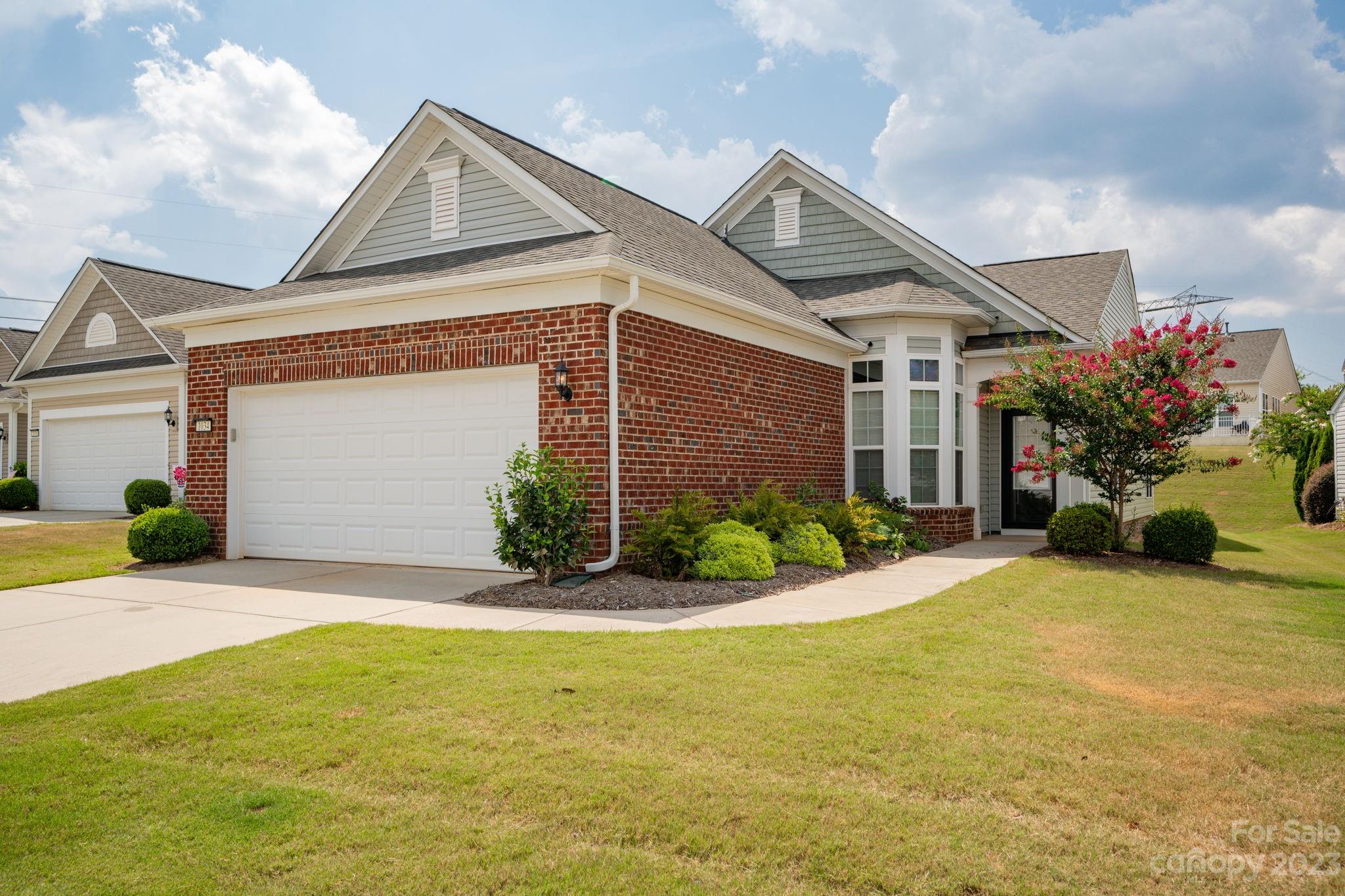 Welcome to 1034 Gregory Jon Ct! An exceptional home blending comfort w/functionality. Open concept layout make the Living & Dining rooms the heart of the home. Gorgeous hardwood floors in main areas. Neutral tile in kitchen, baths & sunroom. Sunroom is another highlight and perfect for morning coffee or a good book. Kitchen is very spacious and bay window area serves as breakfast nook, 42" neutral custom cabinets, lots of granite countertop space, ss kitchen-aid appliances, pass through over sink allows views of DR & LR areas & invites conversations with the chef! Primary suite w/tray ceiling & fan, spacious walk-in closet, en-suite bath has large, tiled walk-in shower, granite tops and dual sinks, cabinets provide lots of storage space. Flex space with French pane doors can easily be used as spare bdrm, private office or craft room! New HVAC 2023! Cozy 2nd bdrm w/ample closet space.  Amenities will impress & exceed all expectations. Embrace the good life at Sun City Carolina Lakes.