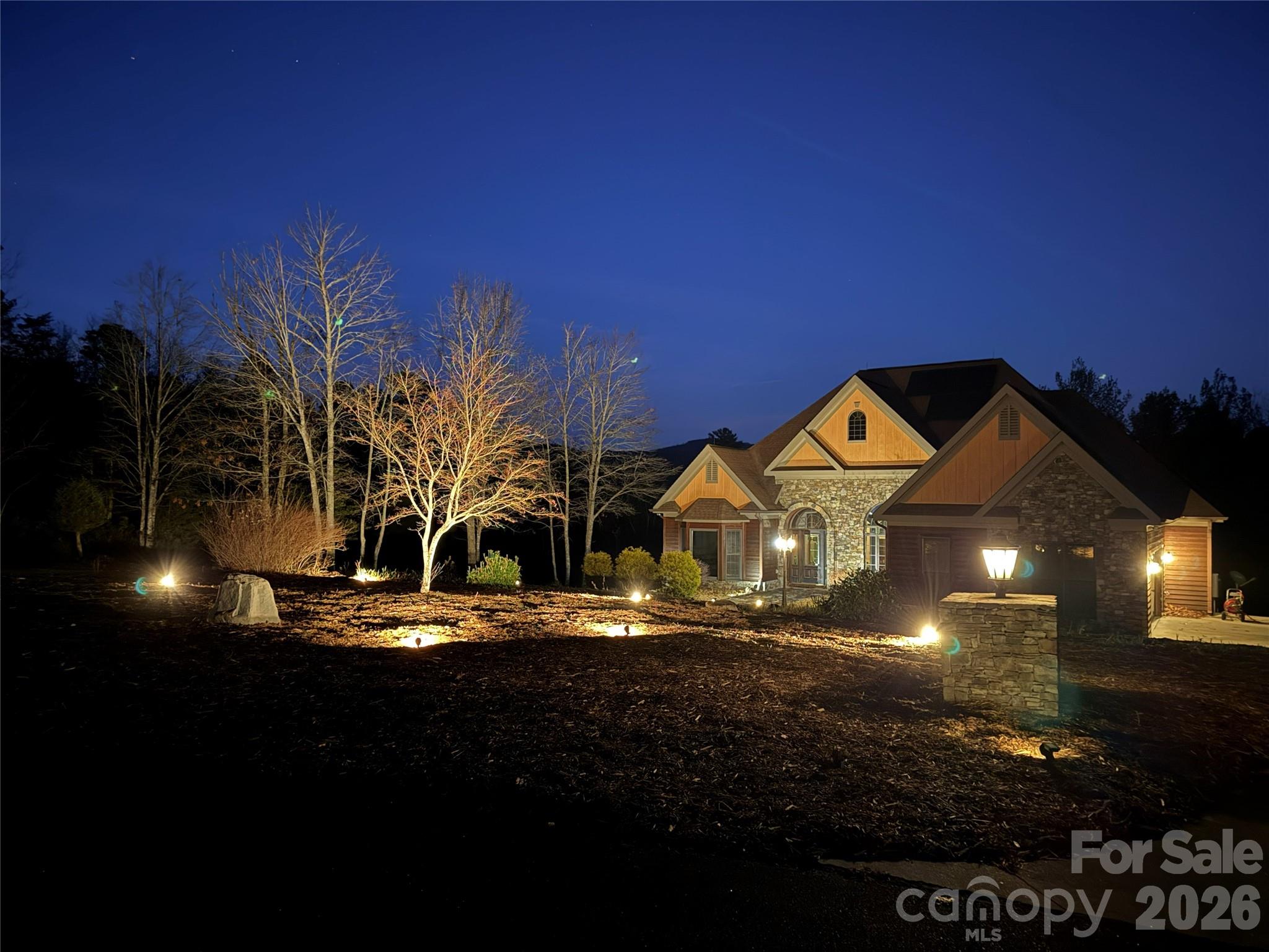 Private Mountain-View Retreat — Turnkey & Ready for Summer 2026 

Lake James is coming alive for summer, and this home is ready for you to enjoy now!

The owned 12 kW solar array offsets approximately 85% of annual electricity usage, and may deliver up to $3,000 per year in savings every year while keeping the home comfortable in all seasons.

Your own private haven above Lake James sits on 2.13 wooded acres in the gated Bear Cliff community, offering long-range mountain views, mature trees, and the rare privacy of bordering protected federal land. Thoughtful upgrades throughout the property make everyday living easy and low-maintenance, with modern systems designed for comfort, reliability, and year-round efficiency.

A circular concrete driveway and native landscaping create a welcoming arrival, leading to multiple outdoor living spaces designed for year-round enjoyment. The wraparound deck, screened porch, and quiet seating areas offer peaceful places to take in long-range mountain and winter views—ideal for morning coffee, evening sunsets, or relaxing after a day on Lake James.

Inside, the home offers true single-level living with bright, open rooms and hardwood floors throughout. The chef’s kitchen features a Wolf gas cooktop, Café double oven, Sub-Zero refrigerator, island, and stainless appliances—an ideal setup for cooking, entertaining, or hosting family gatherings. The primary suite includes heated floors and a custom walk-in closet, while additional spaces such as the great room, dining room, breakfast area, office, media room, recreation room, and utility room provide flexibility for work, relaxation, and guests.

Behind the scenes, the property is engineered for comfort, efficiency, and long-term resilience. Systems include an owned solar array, whole-home generator, dual underground 500-gallon propane tanks, tankless water heater, radiant floor heating, heat pump, underground power, engineered drainage, lightning protection, well water, septic, and remote monitoring for key utilities. Together, these features deliver year-round reliability, reduced operating costs, and a level of infrastructure rarely found in Lake James homes.

The lower level adds a 500-bottle wine cellar and a large workshop with a roll-up door, ideal for tools, projects, or storage. An oversized concrete pad provides dedicated RV and boat parking.

Whether you’re spending the day on Lake James, exploring Pisgah National Forest, or relaxing on the deck, this home offers a private, comfortable, and well-designed retreat with modern systems that support a peaceful mountain lifestyle. Seller is flexible on closing date and requests a 30-day post-closing occupancy.