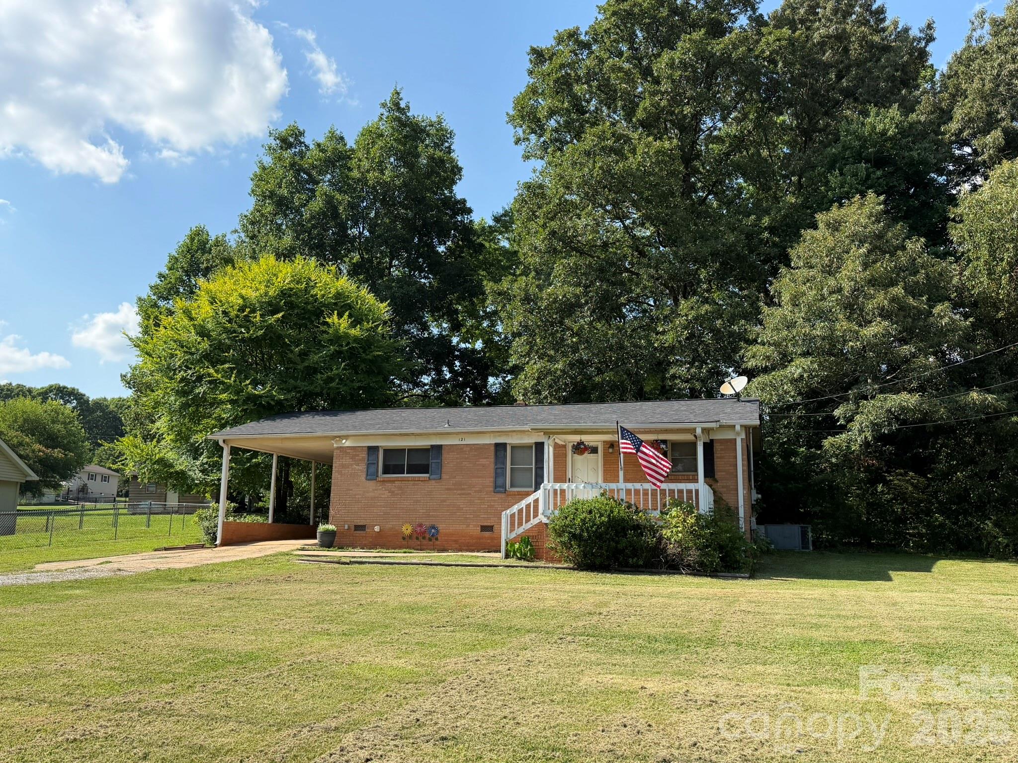 PRENEGOTIATED FOR YOU AT THIS NEW PRICE! Classic charm meets modern comfort. From the moment you arrive, the rocking chair front porch invites you to slow down and enjoy this brick ranch with carport. Features timeless hardwood floors in both bedrooms and the dining area. Lots of updates you’ll also appreciate coming home to include the following: opened up the kitchen to the living room to improve flow for entertainment and daily living. Kitchen updates include kitchen cabinets, tiled backplash, counter tops, sink, faucet, and appliances (refrigerator remains), as well as the flooring in the kitchen, living room and bath. But wait, there’s more! Added new architectural roof (2021), and replaced the old fuse box with a modern breaker panel (2023). In addition to all of those updates, owners also replaced the bath vanity, the garden doors to the deck, as well as the deck top boards overlooking the fenced back yard where there’s a large wired storage building with an enclosed ground level shed on the rear for lawn and garden equipment. All of this country living with private well and septic (meaning no city utilities), and added financial benefit of no city taxes. Near Stanley, but with a Dallas mailing address. Come on home!