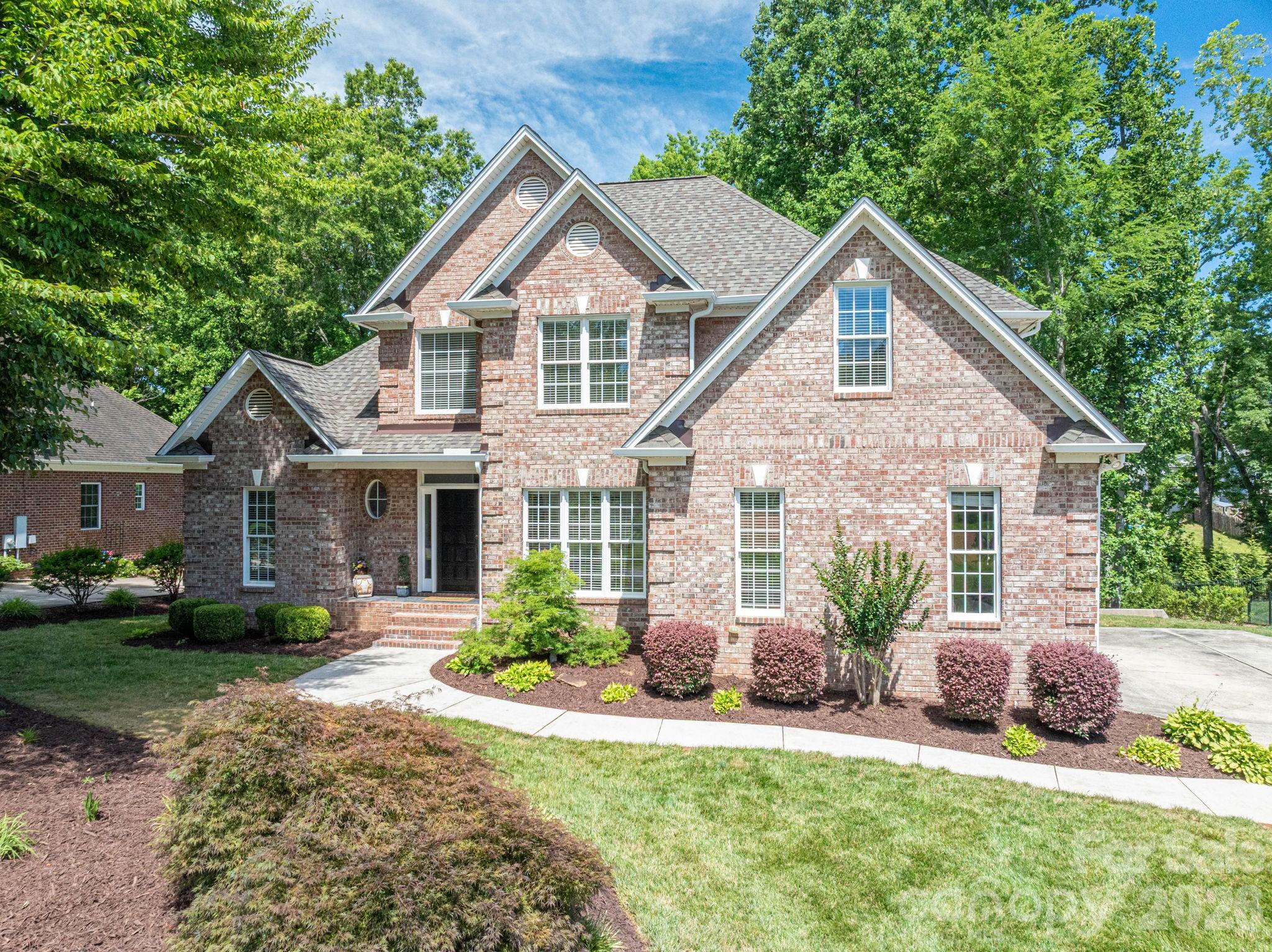 Reduced! Welcome to 4017 Foxes Trail! This Beautifully maintained 4-bedroom, 2.5-bath brick home in the highly sought-after gated Cramer Mountain community checks all the boxes. Situated on a generous 0.42-acre lot, this home offers timeless charm, abundant natural light, and exceptional potential.

Inside, you'll find fresh interior paint, beautiful hardwood floors, and expansive windows that fill the home with warmth and sunshine. The spacious floor plan is designed for both everyday living and entertaining, while the new deck overlooks a sizable backyard, creating the perfect setting for gatherings, outdoor dining, or simply relaxing. 

Primary Bedroom on the main level features tray ceiling with resessed lighting, large ensuite with garden tub and separate shower. Spacious walk-in closet. Living room with vaulted ceilings and gas fireplace. Kitchen area open to additional living space.  

Major updates include a brand New Roof and newer HVAC system (2022), providing peace of mind for years to come. The huge walk-out basement offers incredible storage, flexibility and future expansion opportunities, already plumbed for an additional bathroom and ready to be customized to fit your needs. 

Additional features include an irrigation system, Gorgeous curb appeal with impeccable landscaping, ample living space, and a prime location within one of the area's most desirable neighborhoods. Memberships available seperately that offer a plethera of amentities including Golf course, Outdoor Pool, Tennis, Pickleball and more. Conveniently located just 20 min. to Clt Douglas airport, 30 min. to Uptown Charlotte, close to the Whitewater center and so much more! Don't miss this opportunity to own a well-cared-for home with room to grow in the pristine and luxurious community of Cramer Mountain!