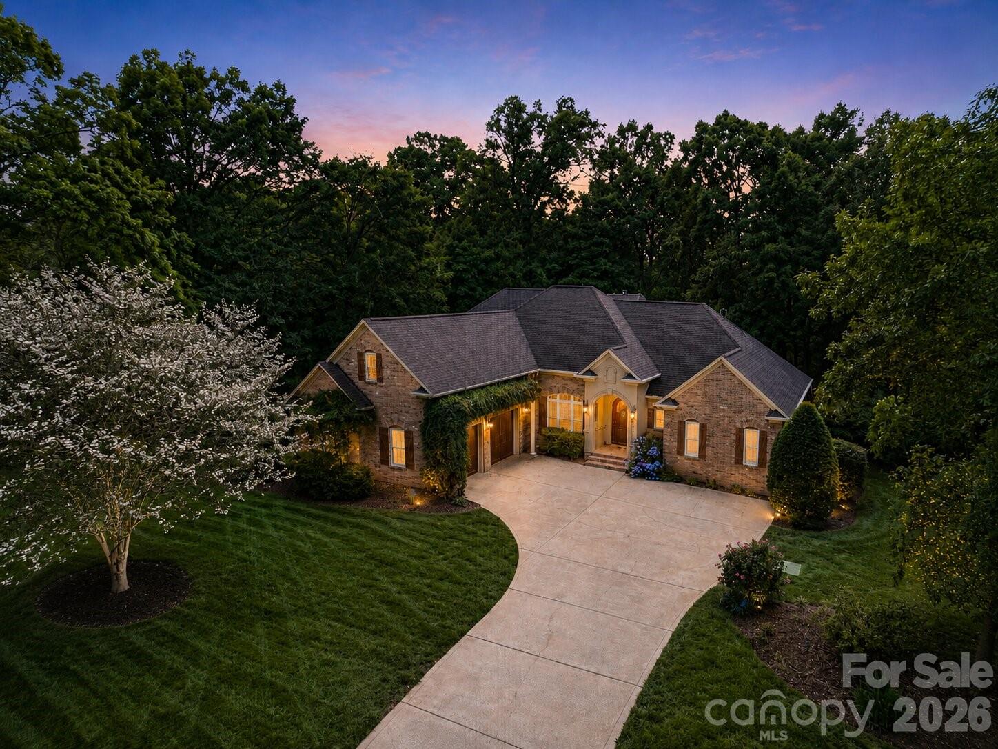 Experience elevated living in this stunning custom-built ranch located in the highly sought-after Cowans Ford Country Club community, just moments from the peaceful shores of Lake Norman. This neighborhood offers more than just a place to live — it delivers a lifestyle with an 18-hole championship golf course, community pool, boat launch, tennis and pickleball courts, along with optional social and golf memberships.

Inside, you are welcomed by impressive 12-foot ceilings and beautiful Brazilian hardwood floors that immediately set the tone. The home showcases quality craftsmanship throughout, including custom wood cabinetry, granite countertops, and upscale tile finishes. Recent updates bring a modern touch with new lighting, updated plumbing fixtures, fresh interior paint, and a beautifully renovated primary bathroom.

The kitchen is designed for both everyday living and entertaining, complete with a newer microwave and oven combo and plenty of workspace. The spacious great room centers around a custom wood and stone fireplace, creating a warm and inviting focal point. The primary suite offers a true retreat with a spa-like bathroom and a professionally designed walk-in closet.

A split-bedroom layout provides privacy, with three bedrooms and 2.5 baths on the main level. Upstairs, you will find a versatile bonus room, an additional bedroom, and a full bath, perfect for guests, a home office, or flex space.
Step outside to a large deck overlooking a beautifully landscaped, fenced backyard, ideal for relaxing or entertaining. Major system updates provide peace of mind, including a brand-new roof installed in May 2026 and updated HVAC systems installed in 2021, offering improved efficiency, comfort, and long-term value.

Additional features include a side-load garage and a prime location with quick access to Highway 16 and 73. The home is just 10–15 minutes from local schools, about 10 minutes to Birkdale Village, and approximately 30 minutes to Charlotte Douglas International Airport and Uptown Charlotte.
Enjoy the best of Lake Norman living with a combination of luxury, convenience, and community in one exceptional property.