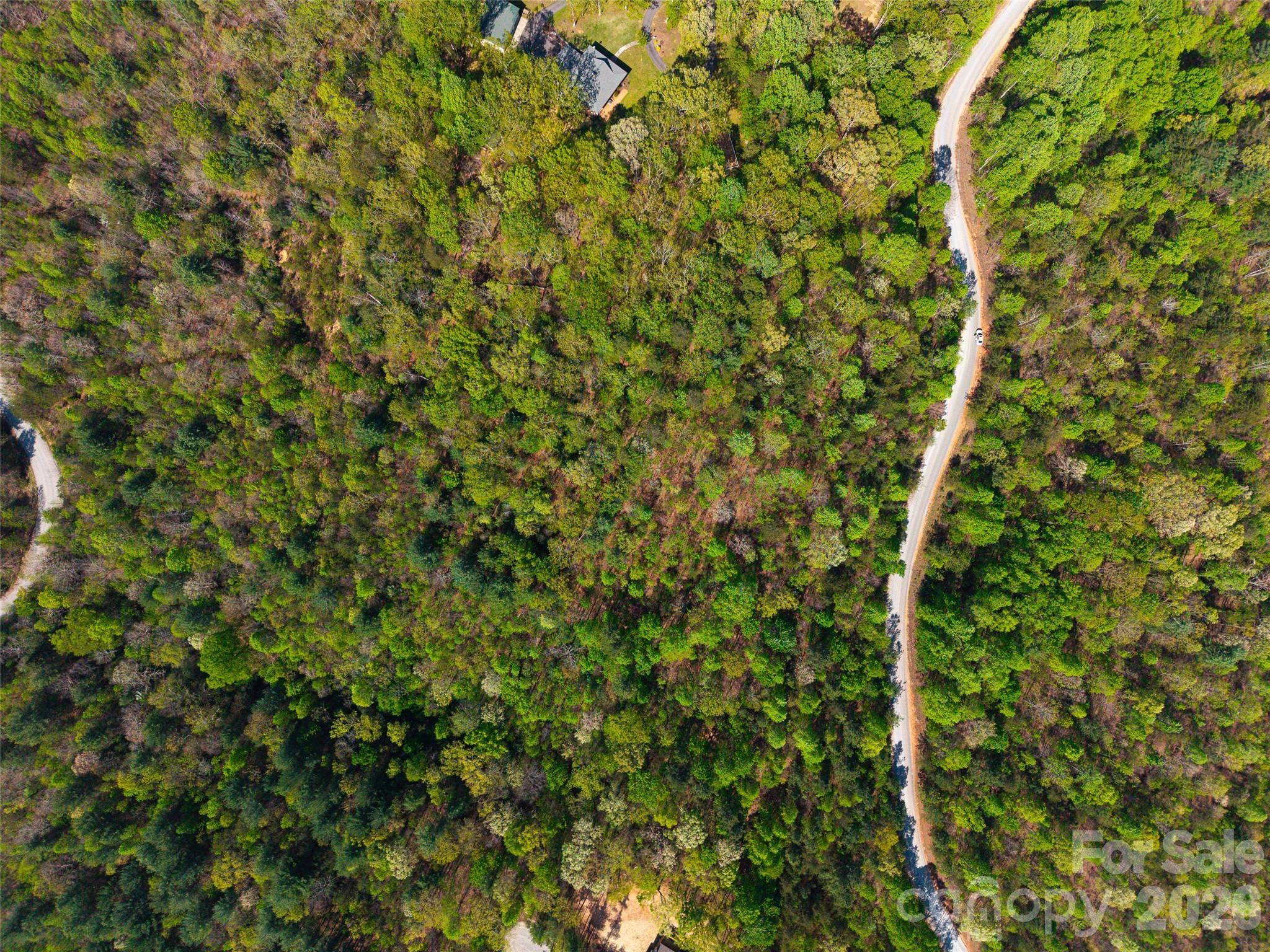 Located in the Darrow Drive area of McDowell County, this 3.2-acre parcel offers road access with electricity available nearby, while a well and septic system would be needed for development. The property is part of an HOA with approximately $300/year dues and a minimum build requirement of around 2,000 sq ft, and it may be subdivided given its size. Previously surveyed and perc tested by the developer, the land is conveniently located about 15–20 minutes from Marion and roughly 45 minutes to Asheville, giving you both privacy and accessibility.
