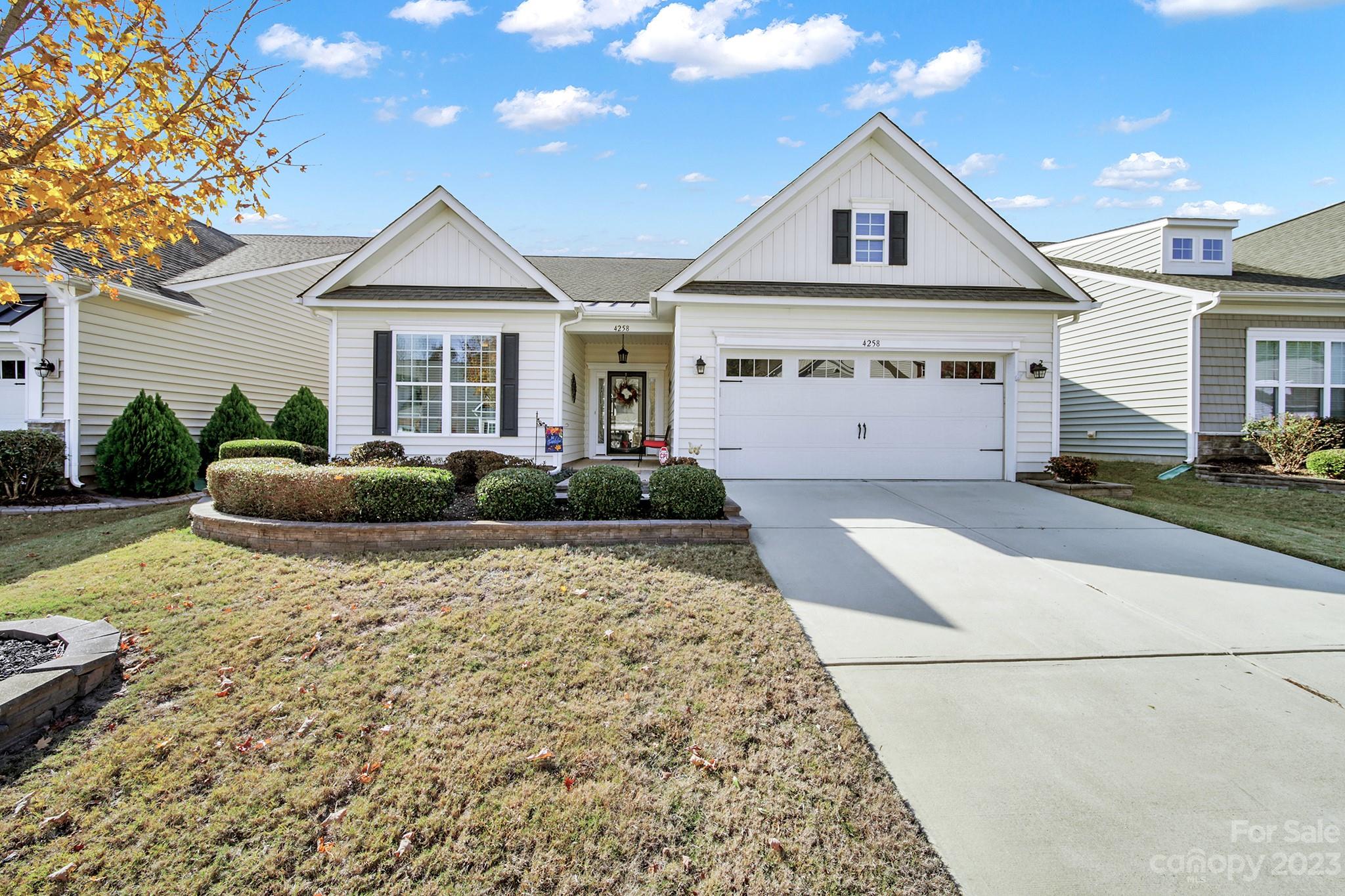 Beautiful 3 bed/3 bath loft home in Carolina Reserve! Pre-finished wood flooring flows throughout the main living areas & kitchen. The open kitchen features granite counters, SS appliances, recessed & pendant lighting, large island w/ bar seating, & a corner pantry. Eat meals at the bar, in the breakfast nook (which overlooks the tree-lined backyard), or in the formal dining room. The great room has a gas-log fireplace for chilly winter days! At the rear of the home is the primary bedroom w/ an en-suite bathroom w/ dual sinks, glass enclosed shower, & a large walk-in closet. An additional bed & hall bath sit at the front of the home. Upstairs is the loft w/ a bonus area & another bed/bath. The 3-season room & back patio are the perfect spots to relax & unwind while enjoying some fresh air! Other features: decorative glass front door w/ 2 sidelights, crown molding & wainscoting accents, ample closet space, & a pre-wired alarm system! Come see this home today!