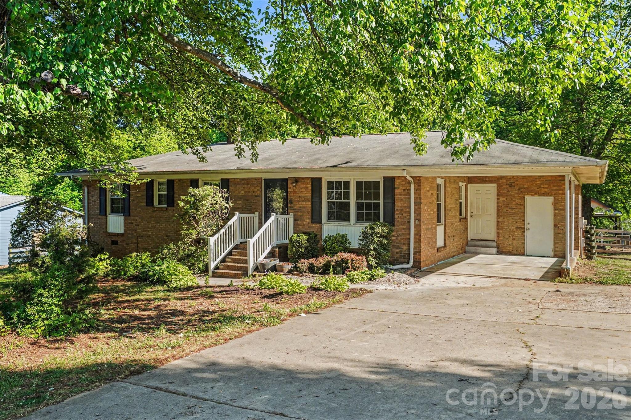 Charming all-brick ranch home nestled in a desirable Mooresville location on nearly half an acre! This well-maintained 3-bedroom, 2-bath property offers hardwood floors and a functional layout. The updated kitchen features butcher block countertops, stainless steel appliances, ample cabinet space, and a layout that opens comfortably to the main living areas, ideal for both daily use and entertaining. The primary suite includes a private en-suite bath, while two additional bedrooms provide flexibility for family, guests, or a home office. Lots of natural lighting throughout the home! From the breakfast area, step out onto the deck and enjoy a large, fully fenced backyard with plenty of room for entertaining, pets, gardening, or simply relaxing. Shed with covered area, previously used for boat storage. Conveniently located just minutes from shopping, dining, and top-rated schools, this home also offers easy access to Lake Norman. No HOA! Enjoy the perfect combination of charm and accessibility in one of Mooresville’s most sought-after areas.