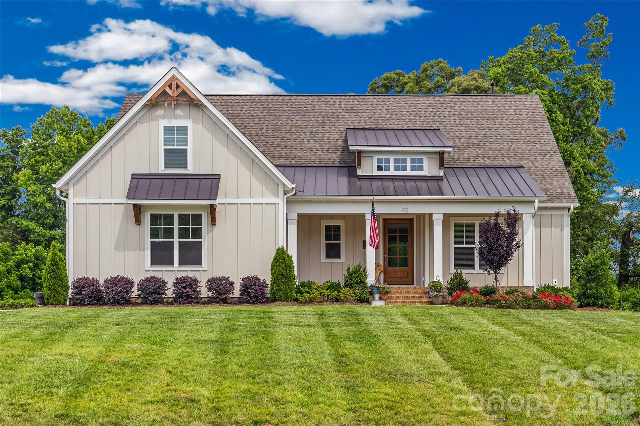 Experience exceptional living in this stunning two year old home situated on a spacious 1-acre homesite. The thoughtfully designed Blakely floor plan offers 4 bedrooms, 3 bathrooms, and a versatile bonus room, blending comfort, style, and functionality. The main level features a private Owner’s Suite with a luxurious bath showcasing a 5-foot soaking tub and a frameless glass shower. Two additional bedrooms and a full bath provide convenient first-floor living for family and guests alike. At the heart of the home, the Family Room impresses with soaring 10-foot coffered ceilings and a dramatic 12-foot multi-slide glass door that seamlessly connects to the screened rear porch with outdoor fireplace, creating the perfect indoor-outdoor living experience.

The gourmet kitchen is beautifully appointed with timeless white cabinetry extending to the ceiling, an upgraded decorative island, elegant quartz countertops, and professional-grade ZLINE appliances. The adjoining casual dining area overlooks the expansive backyard, offering a bright and inviting setting for everyday meals. Upstairs, you'll find a private bedroom with an attached bath, along with a flexible bonus room featuring a closet—ideal for a home office, media room, playroom, or guest space.

Don't miss the opportunity to own this exceptional home in the highly desirable Edmunds Farm community in Clover, South Carolina.