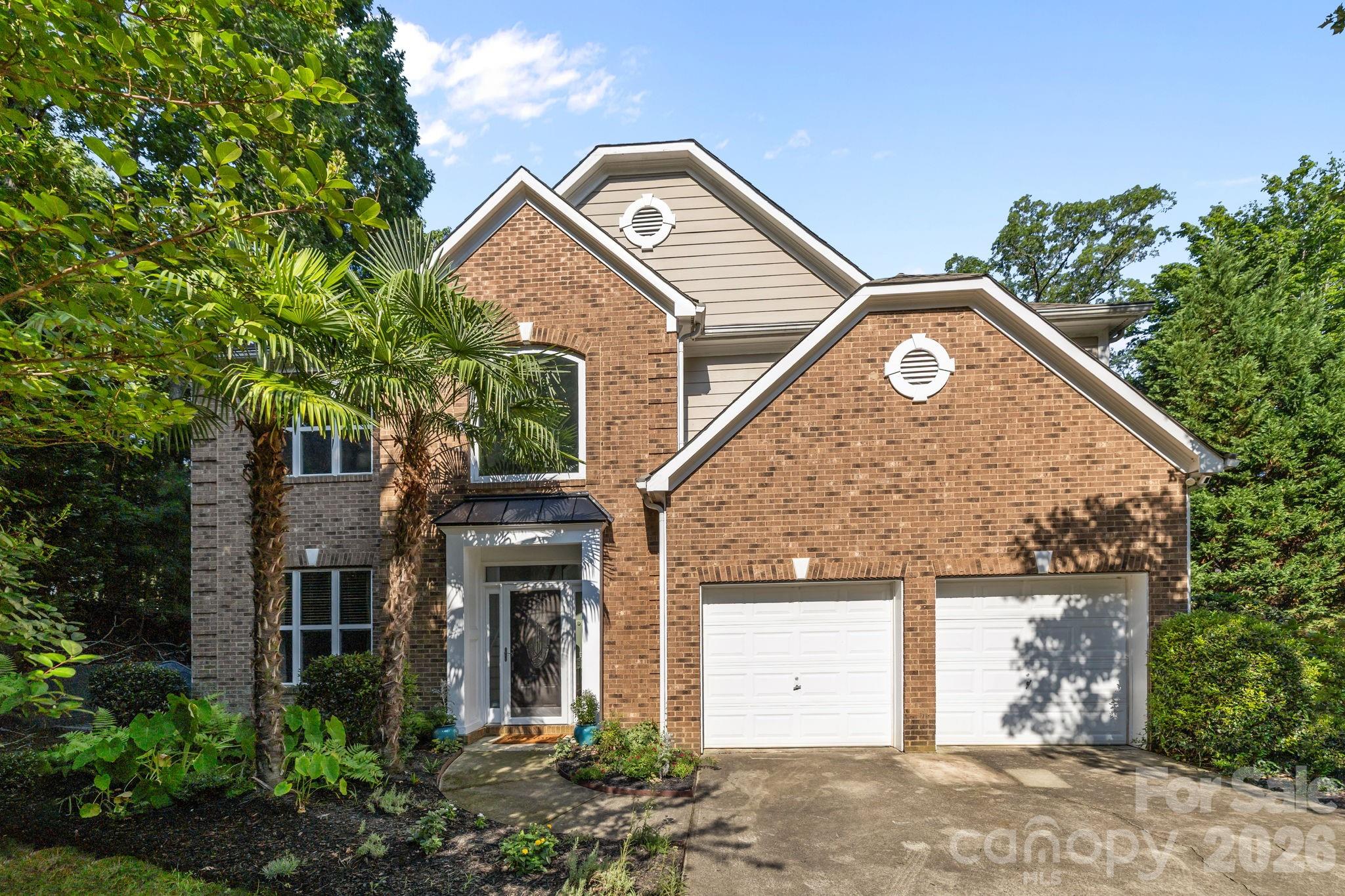 Resort Style Living while still in the city limits of Charlotte. This beautifully updated, well maintained home situated on a 0.95 acre lot offers Lake Wylie water views, deeded boat slip, indoor heated saltwater pool for year round use and unique privacy. Featuring gorgeous hardwoods, formal living room, den with fireplace, separate dining and a kitchen made for entertaining. Elegant French doors open to the large entertainment room with Grecian style pool that will make your home the place to be. Enjoy expansive patios and deck overlooking Lake Wylie and your Deeded Boat Slip in the Community Dock adjacent to the property. Upstairs features a luxurious primary suite, recently renovated spa like master bath showcasing a two-person walk in shower with spa-inspired rainfall showerheads, double vanity and spacious walk-in closet. Soak in the large bathtub below the picture window overlooking the Lake. 3 additional BRs, full BA & laundry room complete the upstairs. Must see to appreciate!