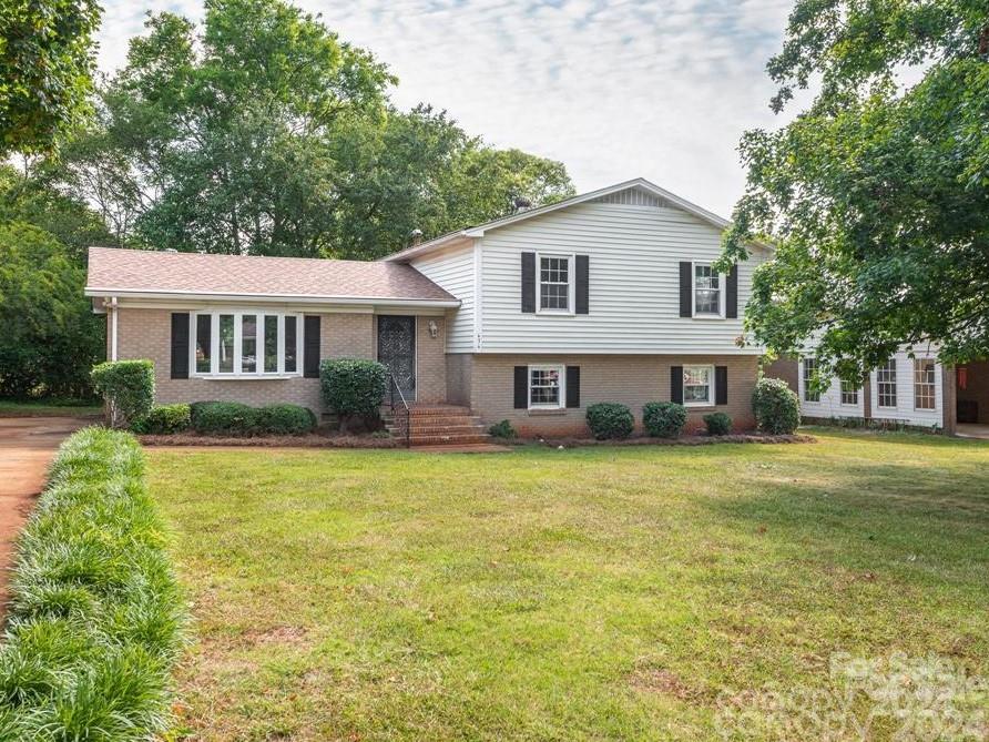 CONVENIENCE, LOCATION, OPTIONS. Welcome to this lovely home with choices! It's thoughtfully designed layout accommodates various living needs and preferences. The lower level is its own sanctuary, complete with laundry area, family room, bedroom, full bath, and an outside entrance. It's perfect for the family member needing his or her own space and privacy. The upper level comprises of three bedrooms and an easily accessible full bathroom, while the main level is the heart of the home. The kitchen, adjoining dining room, and nicely-sized living room allow for family and friend gatherings. The home also features a TANKLESS water heater, fenced backyard, and driveway with ample parking space. Nestled in desirable Winthrop Heights, this home is conveniently located to Cherry Park, shopping, and all that Rock Hill has to offer.
