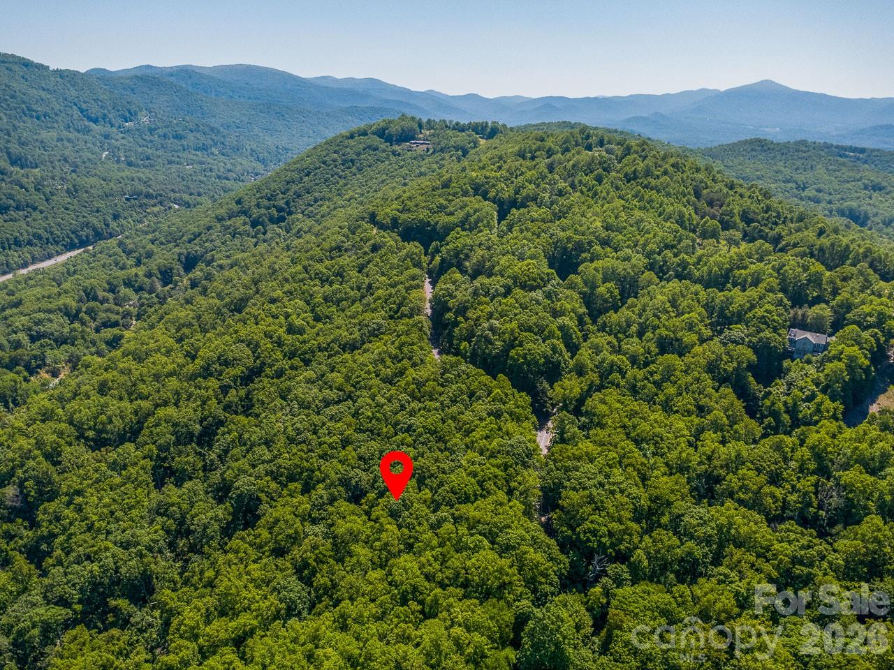 Discover the freedom to build your mountain dream on this beautiful 3.49-acre homesite located on scenic Cedar Mountain Road just ten minutes to downtown Asheville and five minutes to the Blue Ridge Parkway. Offering breathtaking long-range, year-round mountain views, this property combines privacy, natural beauty, and convenience in one of Western North Carolina’s most desirable areas — with no HOA restrictions to limit your vision. The seller has done the heavy lifting for you - septic approval, well approval, and geotechnical reports have all been obtained for your peace of mind! Rarely do you find acreage with long-range views, flexible use potential, and this kind of location all in one package. Bring your builder, your vision, and your rocking chairs — the mountains are calling.