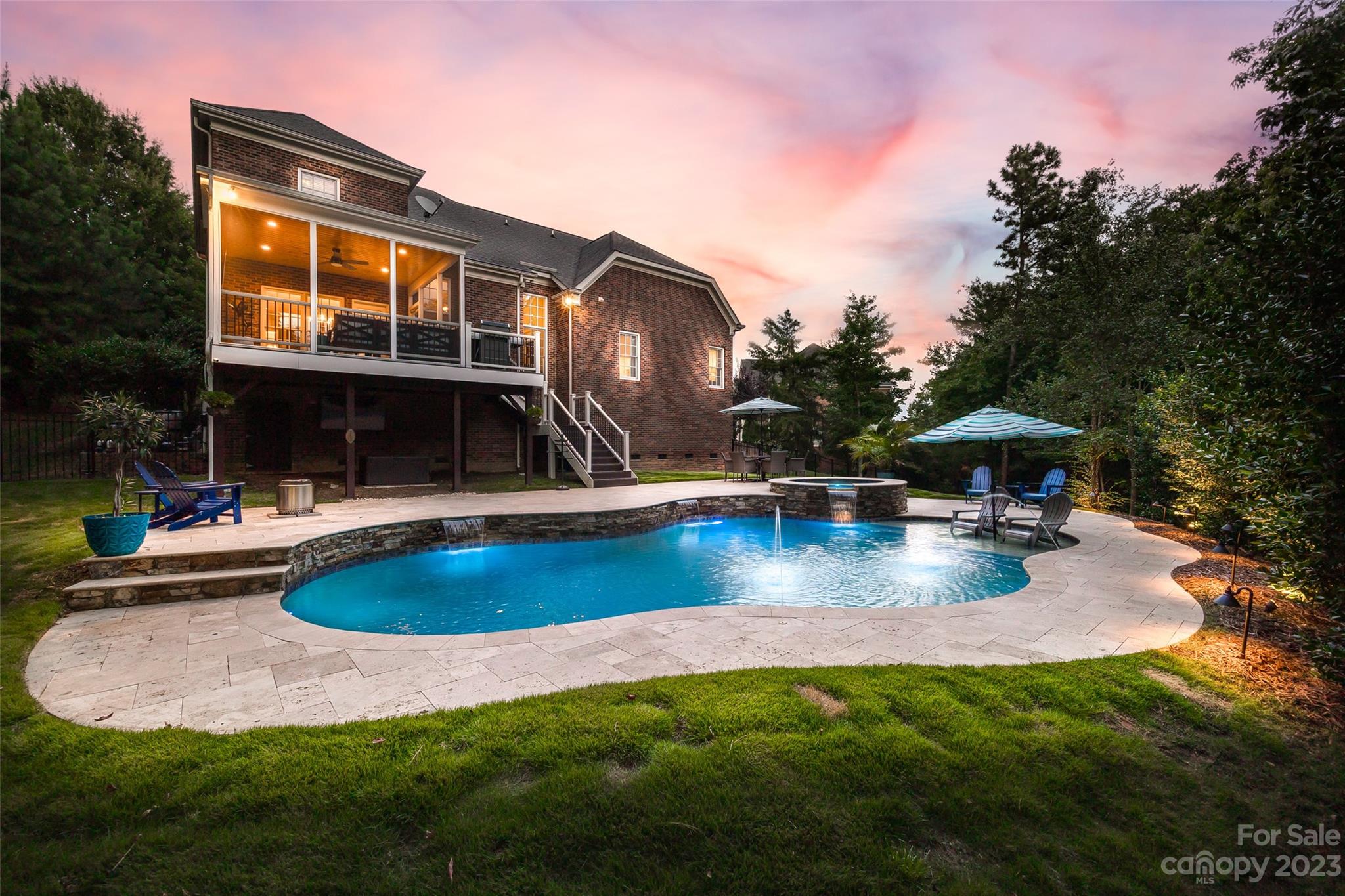 Nestled in a stunning backdrop of trees on a .61 acre cul-de-sac lot, this backyard oasis boasts a saltwater pool w/ spa/hot tub, waterfalls, sun shelf, generous travertine patio w/ Zoysia yard, & composite screen porch to take in the views! The all brick home has a 3-car side-load garage, welcoming 2-story foyer that is flanked by office w/ french doors & dining, & opens to the great room w/ vaulted ceiling & gas fireplace. The kitchen has endless counter area, gas range, & new appliances (20-21). The primary bed rounds out the main floor, & upstairs you'll find 4 additional bedrooms (1 as a bonus/bed), & a beautifully remodeled secondary bath. New upstairs HVAC 2023 & attic walk in space had ductwork ran. New tankless hot water heater 2023. With low SC taxes, this community has no HOA, & the Tega Cay amenities incl 10+ parks, beach/lake access, trails, optional swim club/pool w/ gym, golf, tennis, & the school is at the neighborhood entrance. Video tour: https://vimeo.com/862533781