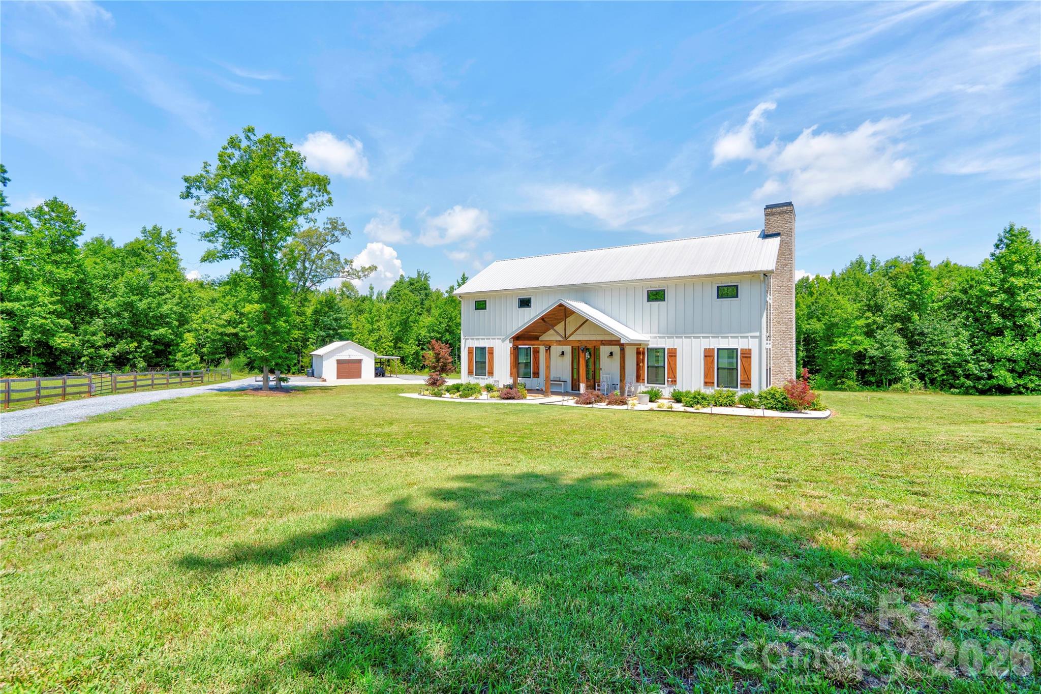 Built in 2021, this stunning home sits on 18.86 picturesque acres and offers the perfect blend of modern comfort and country living. Featuring 3 bedrooms and 2.5 bathrooms, the home boasts an open, spacious floor plan designed for both everyday living and entertaining. The kitchen is beautifully appointed with quartz countertops, stainless steel appliances, and a walk-in pantry. The primary suite includes dual vanities and a private retreat feel. The main living area is highlighted by a rock fireplace with gas logs, creating a warm and inviting focal point. Upstairs, you’ll find a versatile loft space, two additional bedrooms, and a full bathroom. Enjoy peaceful views from the 600-square-foot screened-in porch, perfect for relaxing or entertaining outdoors. The property also includes a detached storage building, a fenced-in area with a barn and chicken coop, and a creek running along the back property line. This one-of-a-kind property offers privacy, acreage, and modern amenities — a true country retreat with room to roam.