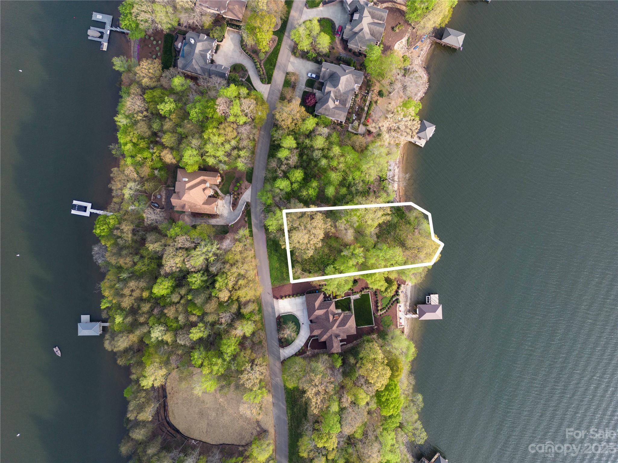 Back on market at no fault of seller. Build your dream home on the EXCLUSIVE Windemere Island! This deep water lot with 115' of shoreline on the main channel side of the island offers STUNNING year round views of Lake Norman. This incredible subdivision is adjacent to the gorgeous Lake Norman State Park where you can access miles of hiking and biking trails and beach. Community amenities include a pool, club house and tennis courts. Don't miss this AMAZING waterfront home site! Preliminary engineering analysis has been performed for the construction of a proposed home. Additional information available upon request. **You must be accompanied by a Realtor or Real Estate agent with a scheduled appointment to enter property. Walk property at your own risk as the lot has not been cleared and has a steep descent down to the water.**