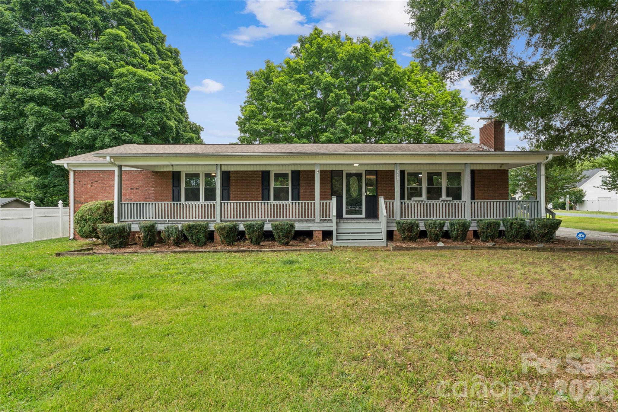 Welcome to this beautiful updated full brick home. Featuring 4 bedrooms 2.5 bathrooms, open floor plan, fireplace, 2 back decks, basement, huge front porch and fenced in back yard, with an additional workshop building outback! The updated kitchen features quartz countertops, stainless steel appliances and a seamless flow into the living room featuring a fireplace. The spacious primary suite features a walk in closet with double doors, a stylish primary bathroom accented with a barn door, and private access to it own deck. The half bath is conveniently designed with dual access from 2 bedrooms. Enjoy multiple outdoor living spaces with a huge covered front porch, a deck off the kitchen, great for grilling or gatherings, with a fenced in backyard with plenty of space.  The wrap around drive way provides plenty of parking with easy access. The basement offers flexible space for a workshop or hobbies. In addition, a detached storage shed in the backyard provides even more room storage. Convenient to downtown Landis and just minutes away from downtown Kannapolis! This home is truly one you don't want to miss!