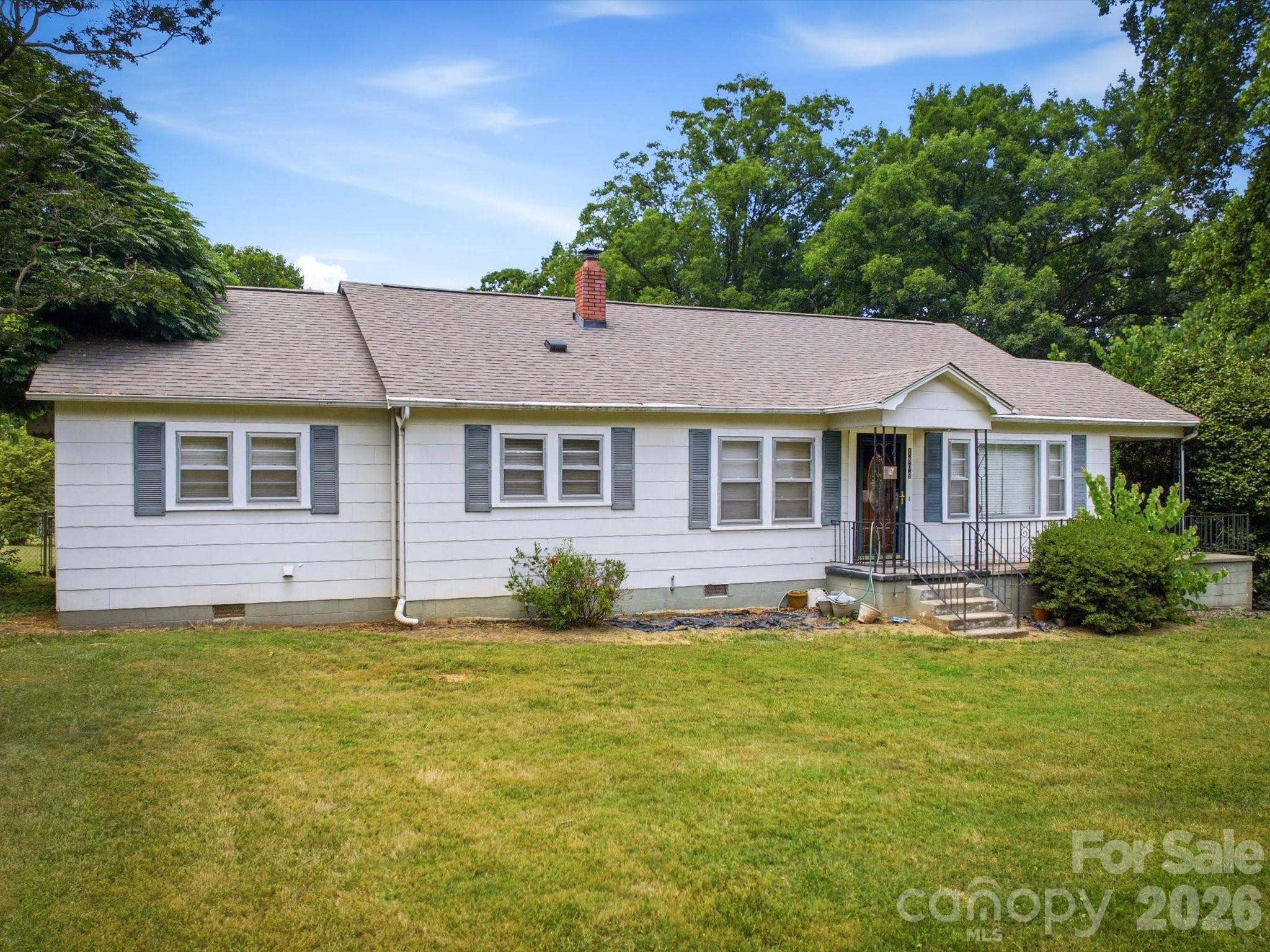 This 3-bedroom, 2-bath home sits on 1.02 acres with a full unfinished basement and spacious bedrooms featuring hardwood floors, a large living room, and multiple bonus rooms. The property has been vacant for some time and will require TLC to refresh the interior and bring systems up to modern standards. Recent updates include a new 200-amp electrical panel and a new hot water tank installed in the basement, along with city water and septic system, and Spectrum internet available. Outside, there’s ample storage including a metal garage/storage building, a second large double garage with multiple rooms and a plumbed-in bathroom, an attached lean-to, and a third wooden storage building—plus plenty of space for a garden. Located in the county between Morganton and Valdese, near I-40, this property offers potential to be transformed into a dream home, with a recent March 2026 appraisal listed below value, and the seller is willing to entertain all offers. Come take a look.